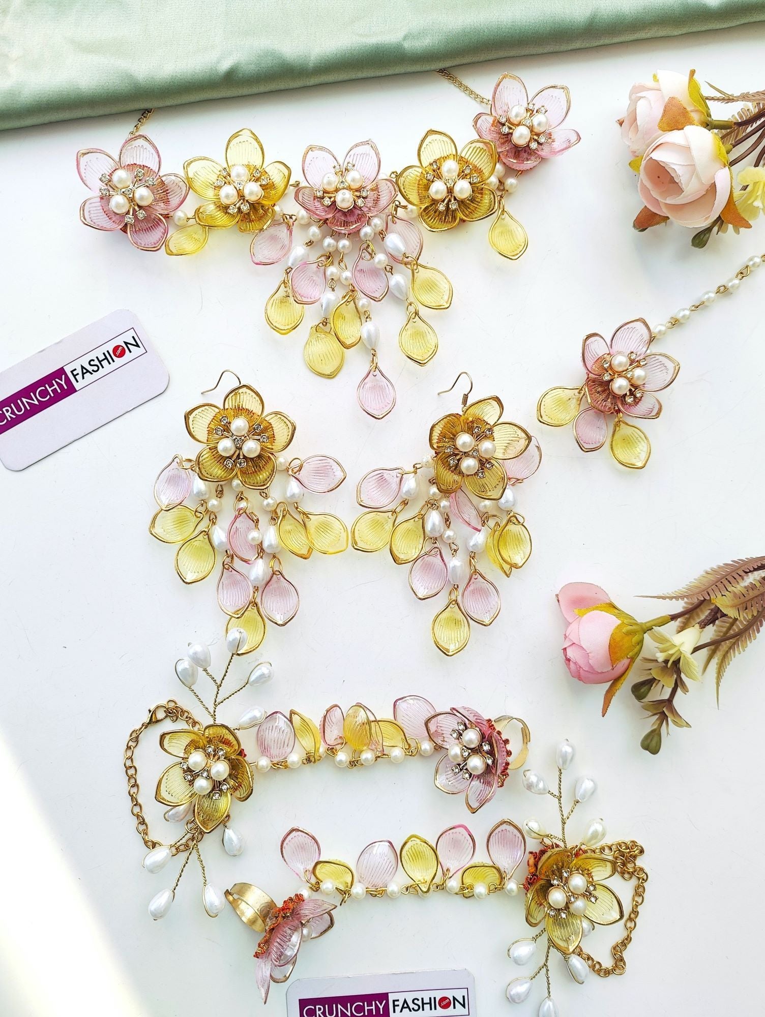 Handmade designer resin carnival jewellery set for brides in yellow-pink floral theme with gold plating for haldi-mehndi