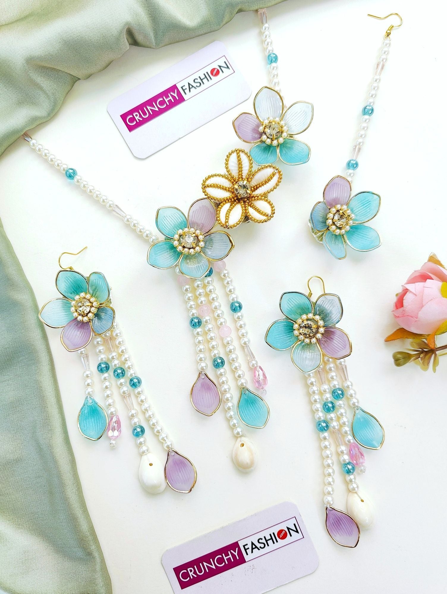 Powder blue bridal jewelry set with floral accents for haldi | mehndi, crafted from resin, beads, gold plating.