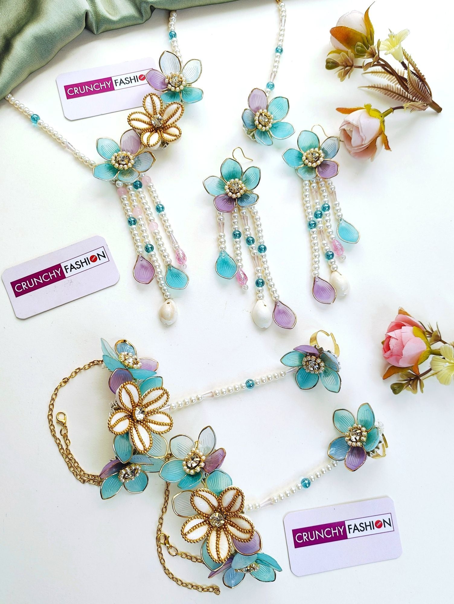 Powder blue bridal jewelry set with floral accents for haldi | mehndi, crafted from resin, beads, gold plating.