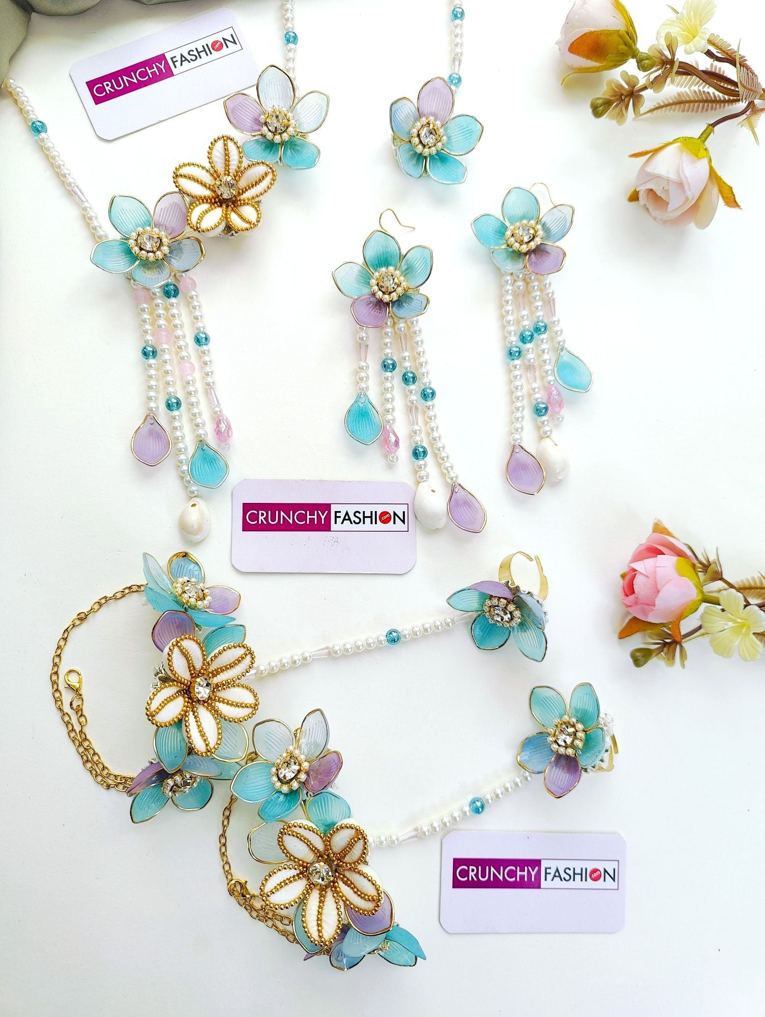 Powder blue bridal jewelry set with floral accents for haldi | mehndi, crafted from resin, beads, gold plating.