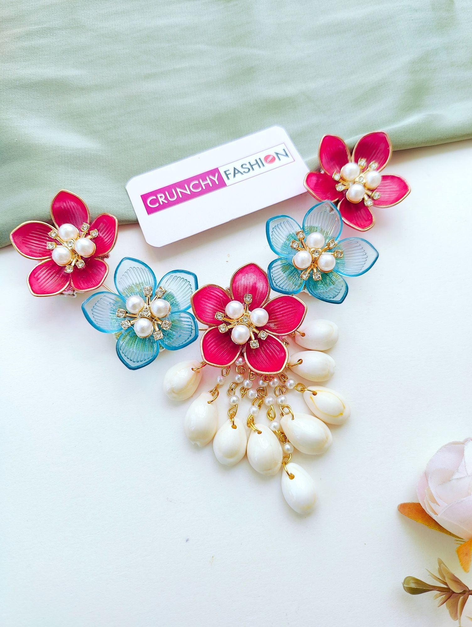 Sky-blue and pink floral resin jewellery set with gold plating, ideal for haldi or mehndi ceremonies for brides