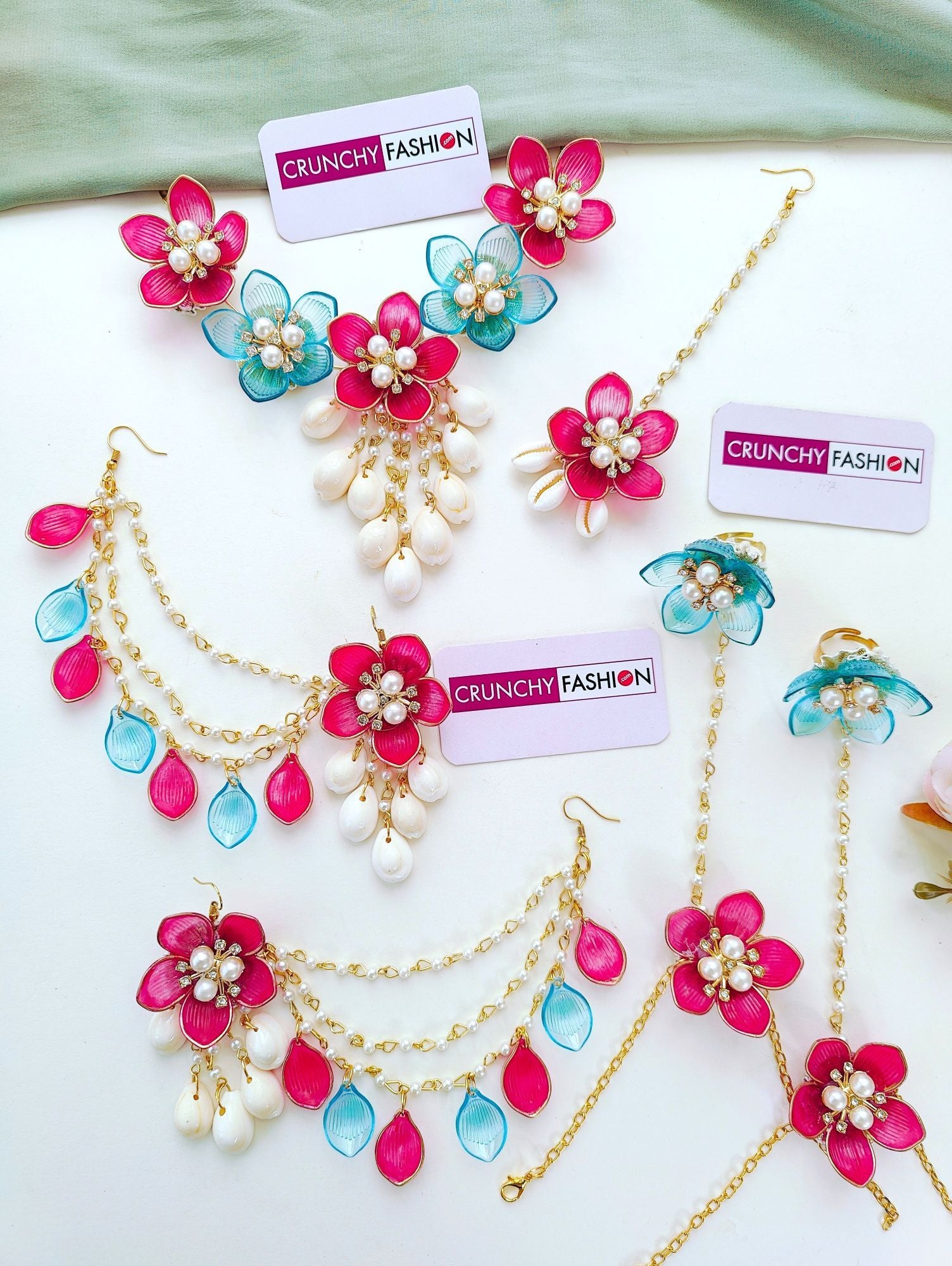Sky-blue and pink floral resin jewellery set with gold plating, ideal for haldi or mehndi ceremonies for brides