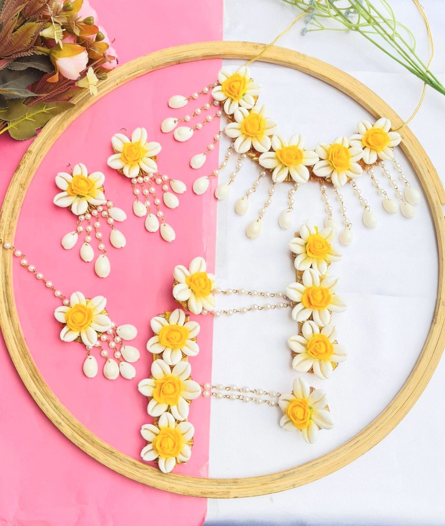 Yellow shell-made ethnic flower-themed jewellery set for baby shower featuring necklace, earrings, and maang tikka