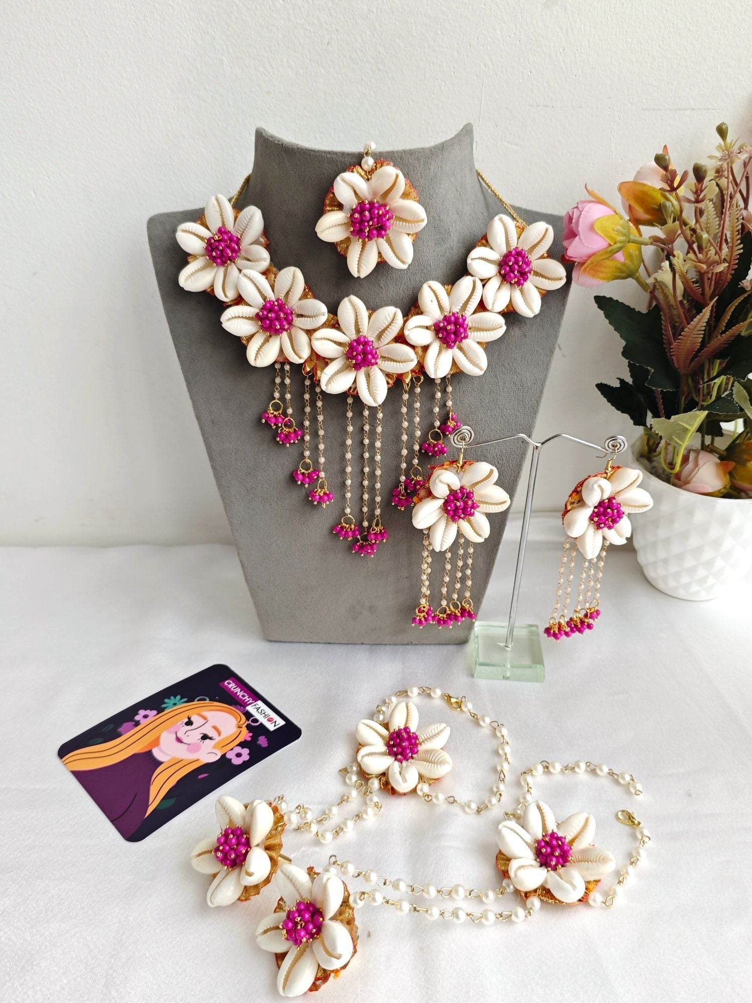 Pink flower-themed ethnic jewellery set ideal for baby shower and maternity shoot, includes necklace, earrings, and maang tikka.