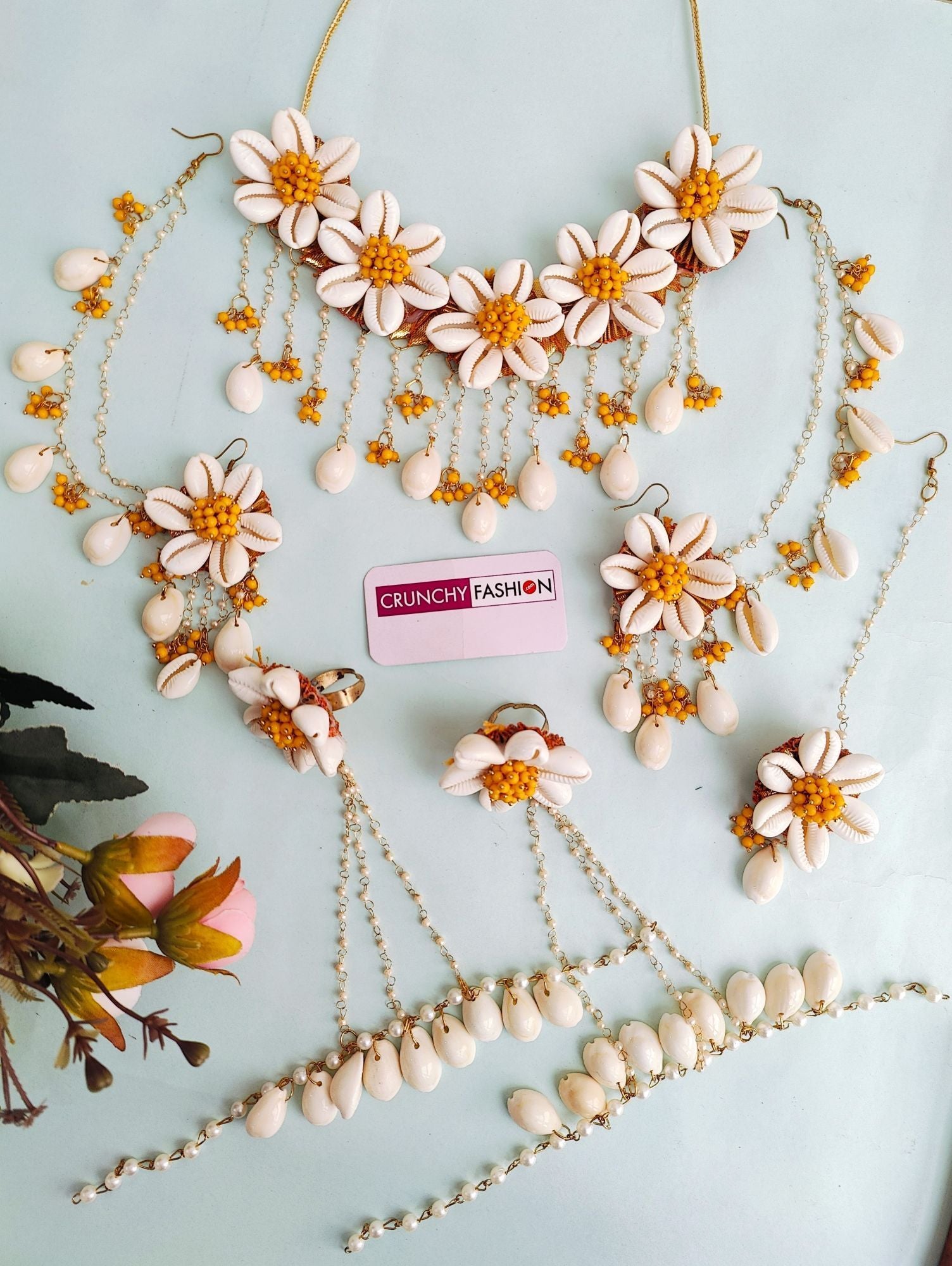 Yellow and white seep moti flower-themed baby shower jewellery set for women, including necklace, earrings, and more.