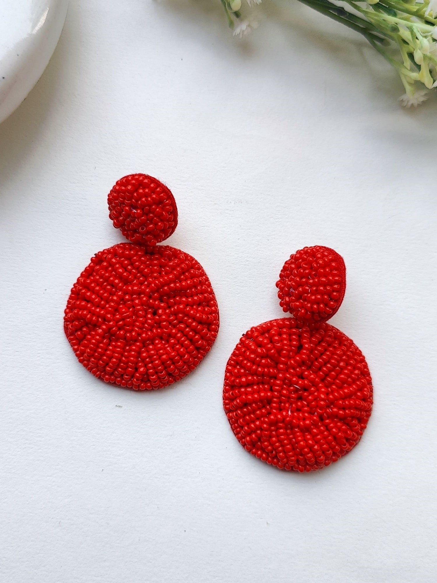 Handcrafted Sky Blue Beaded Danglers: A Fashionista's Statement Earrings