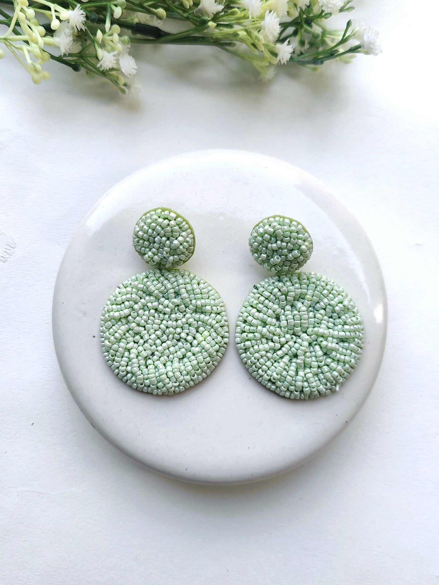 Handcrafted Sky Blue Beaded Danglers: A Fashionista's Statement Earrings