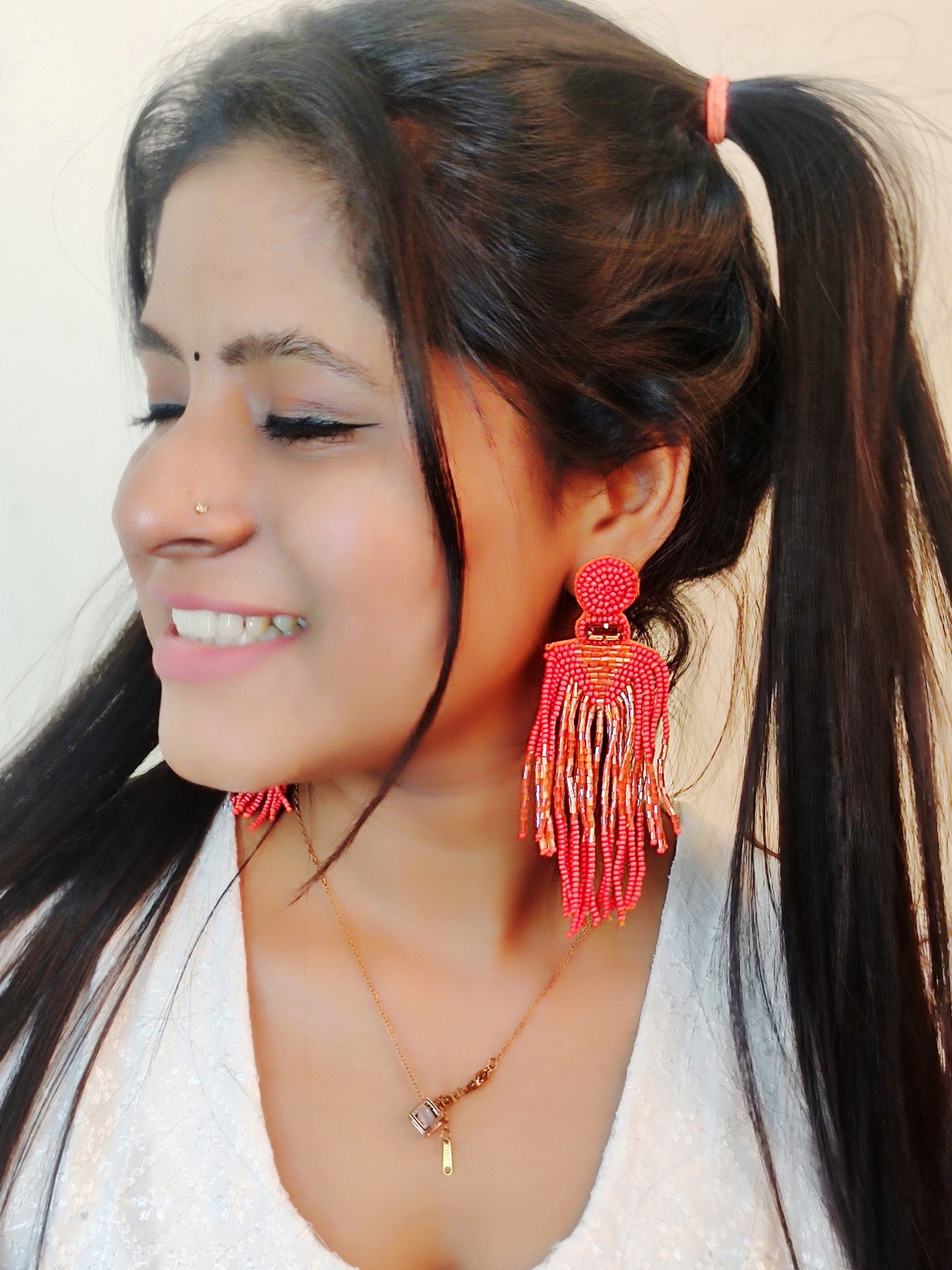 Chic Carnival: Orange Handmade Tassel Earrings for Quirky Fashionistas