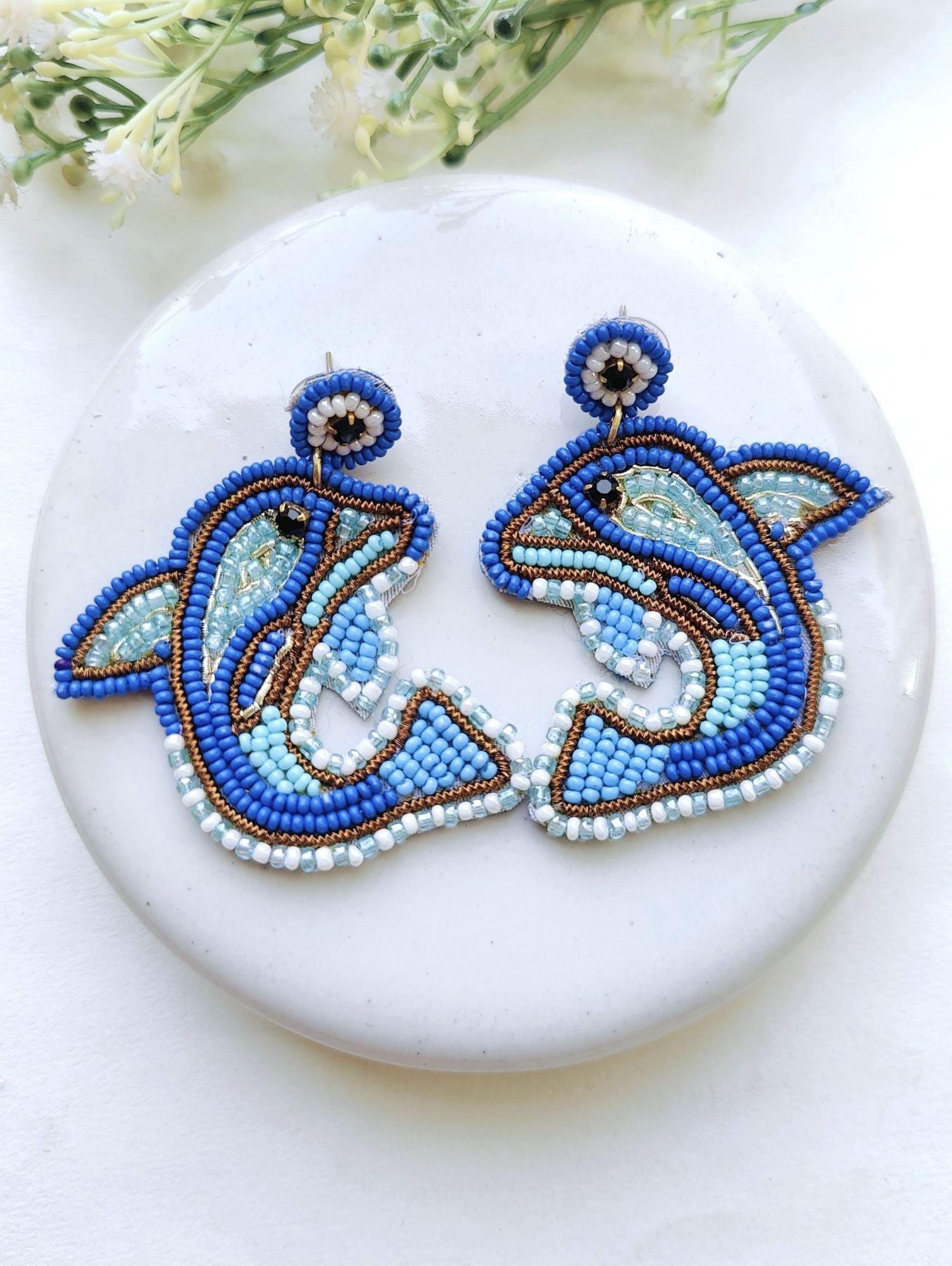 Handmade, quirky, beaded Dolphin Earrings in shades of blue, perfect for everyday wear or gifting. Ideal for women and girls.