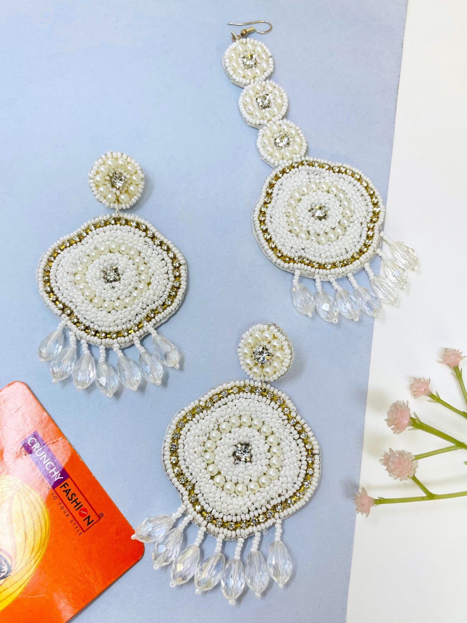 White handmade beaded earrings from HANDICRAFT collection designed with floral theme, suitable for weddings and ideal for women and girls in Summer and Spring seasons.