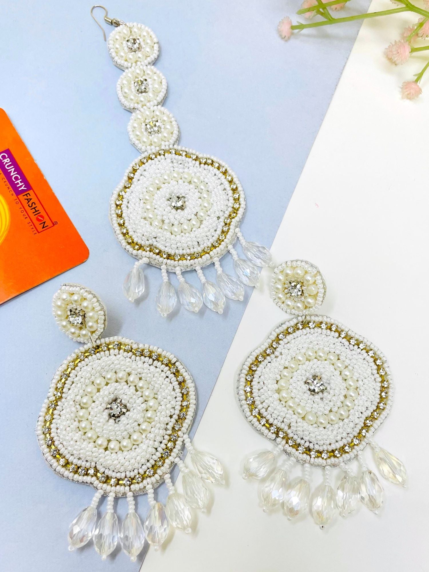 White handmade beaded earrings from HANDICRAFT collection designed with floral theme, suitable for weddings and ideal for women and girls in Summer and Spring seasons.