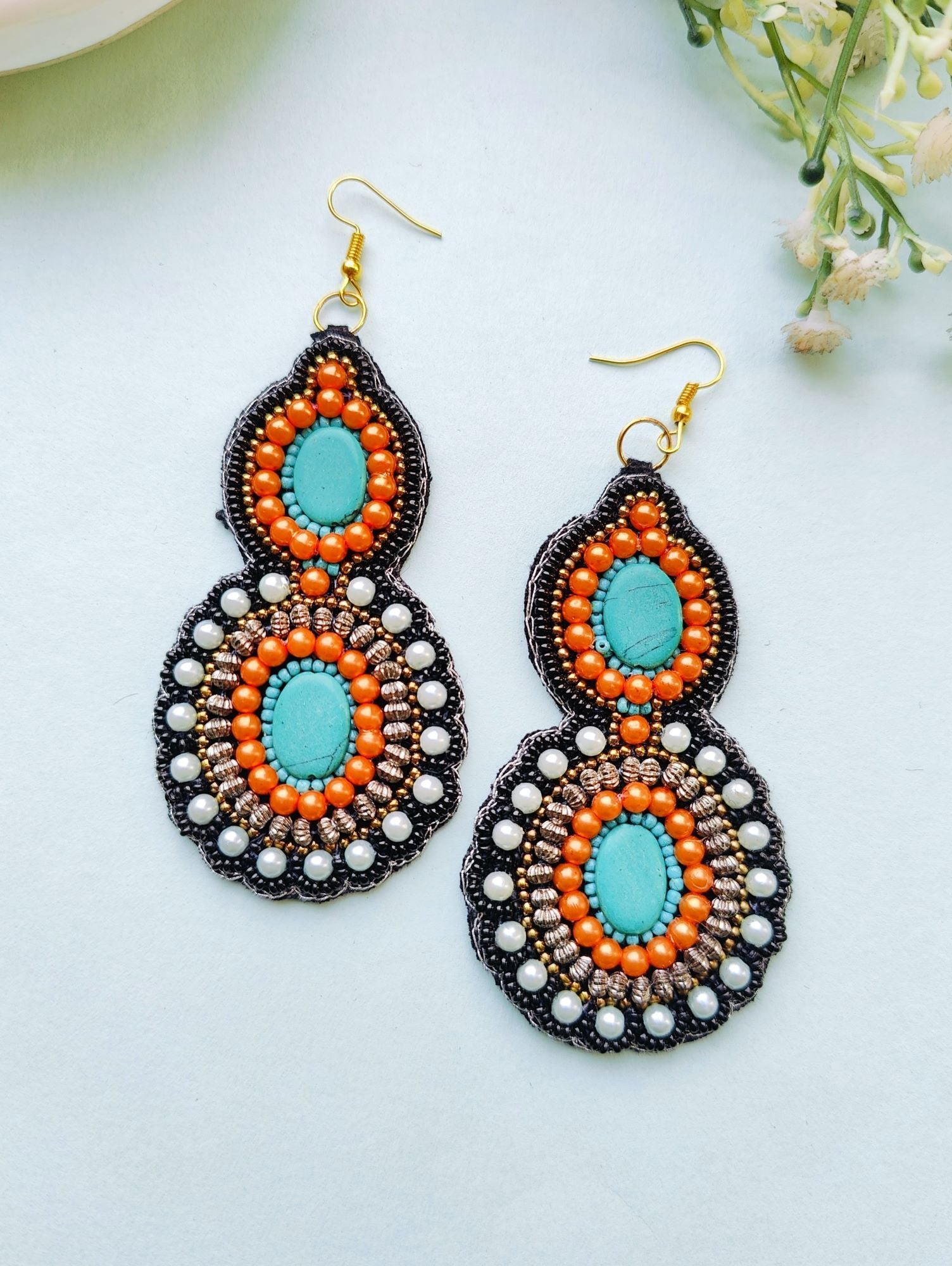 Pink beaded handmade earrings with tribal design, ideal for women and girls at festivals, weddings or parties. Antique themed, from the HANDICRAFT collection.