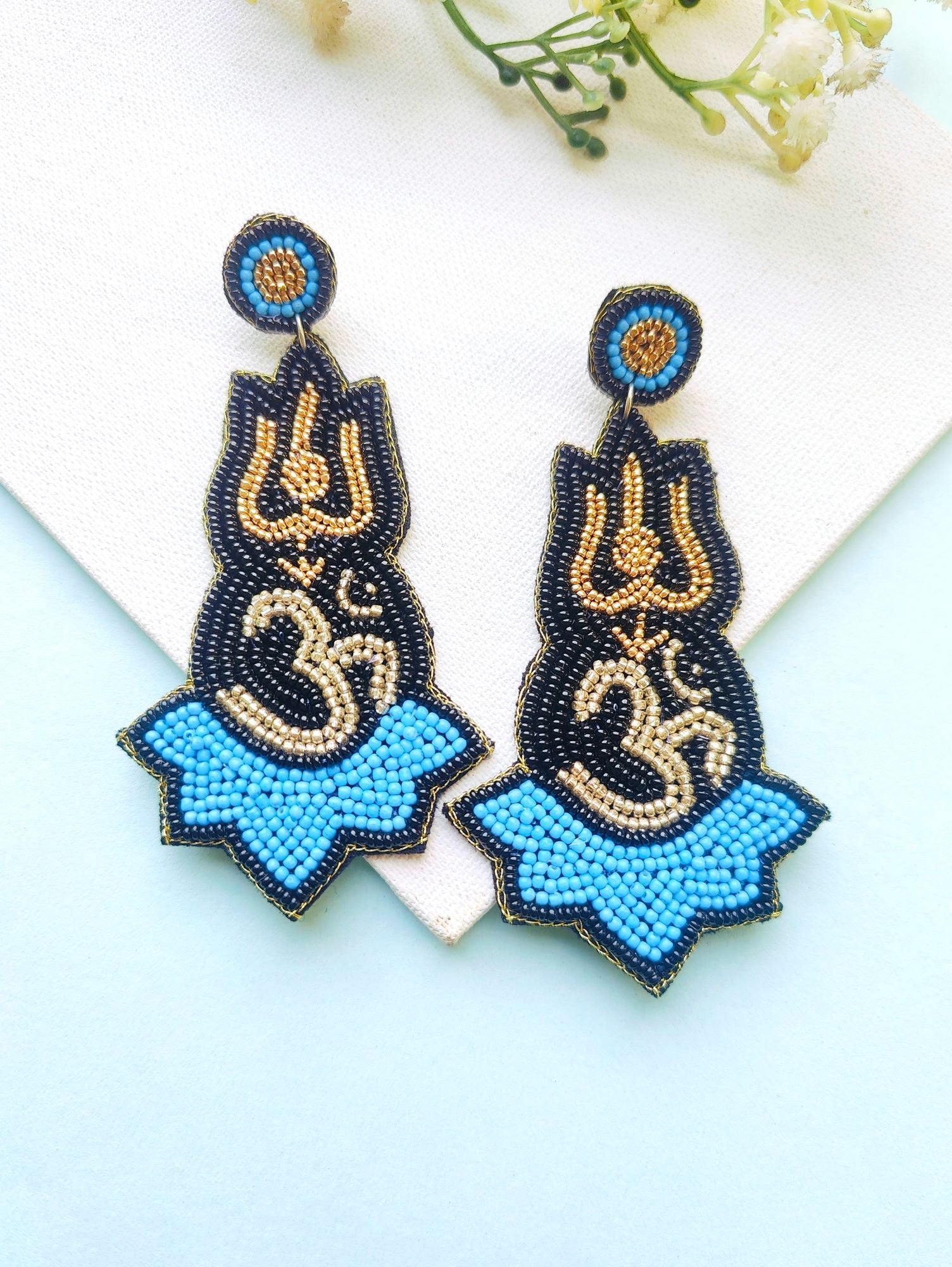 Blue beaded handmade Om Earrings in drop and dangler style, perfect for women and girls for daily use, festival, birthday or Valentine occasions.