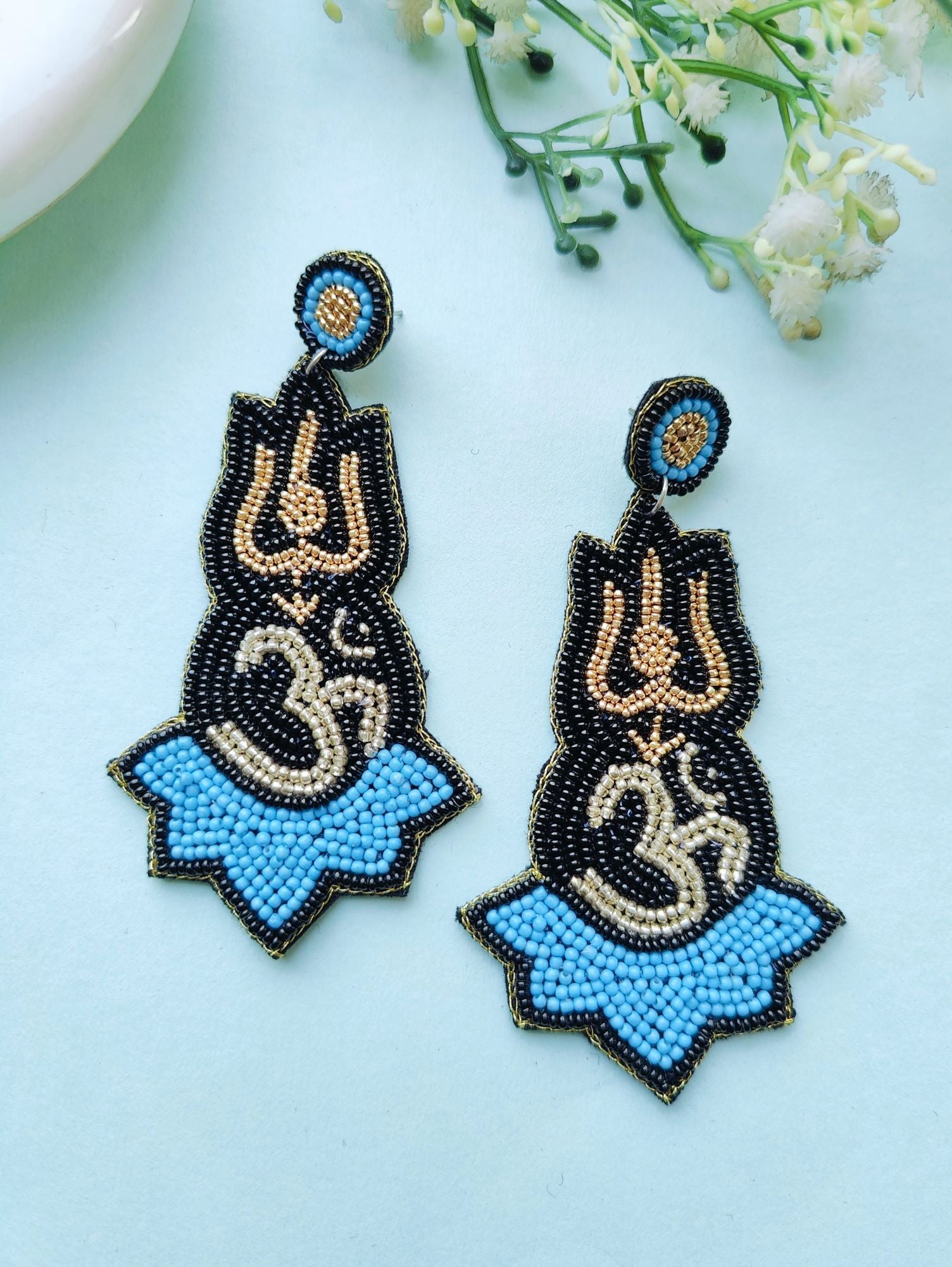Blue beaded handmade Om Earrings in drop and dangler style, perfect for women and girls for daily use, festival, birthday or Valentine occasions.