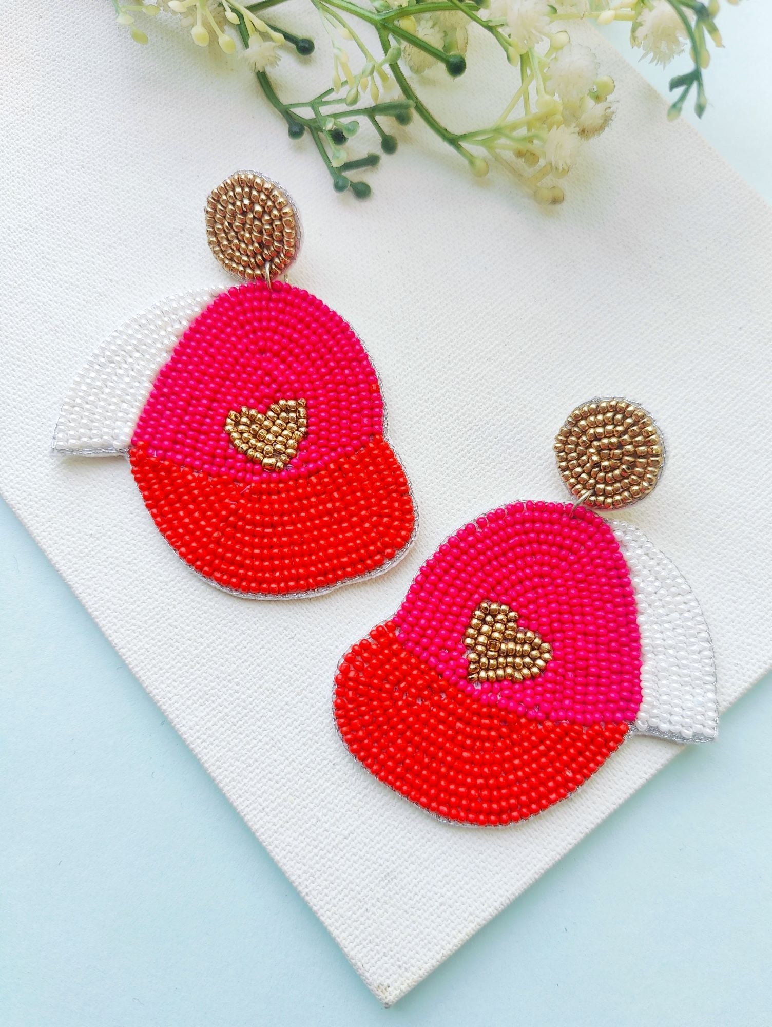 Pink beaded handmade earrings in a heart design, perfect for Valentine's, parties, or everyday wear for women and girls who love sports