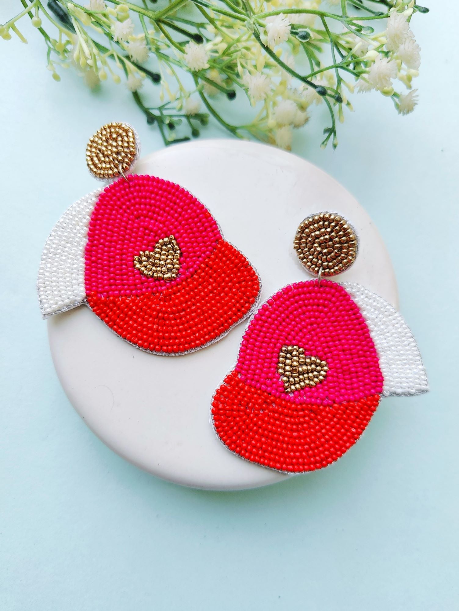 Pink beaded handmade earrings in a heart design, perfect for Valentine's, parties, or everyday wear for women and girls who love sports