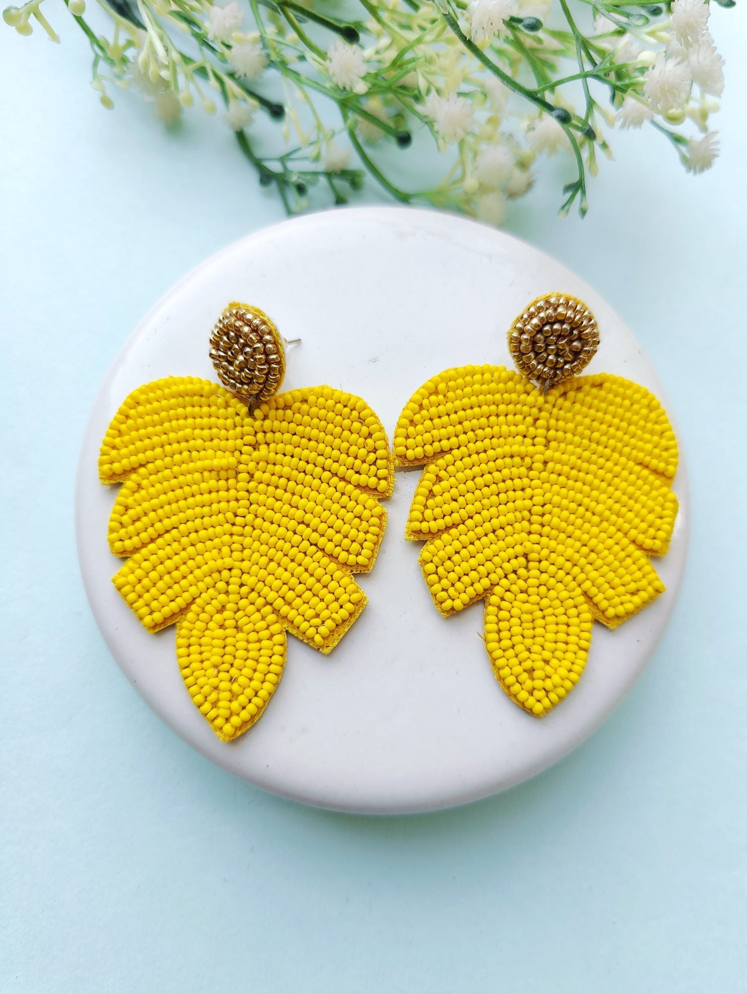 Handicraft collection beaded handmade earrings in leaf shape, vibrant yellow in color, ideal for women and girls to wear in daily life, festivals, or birthdays.