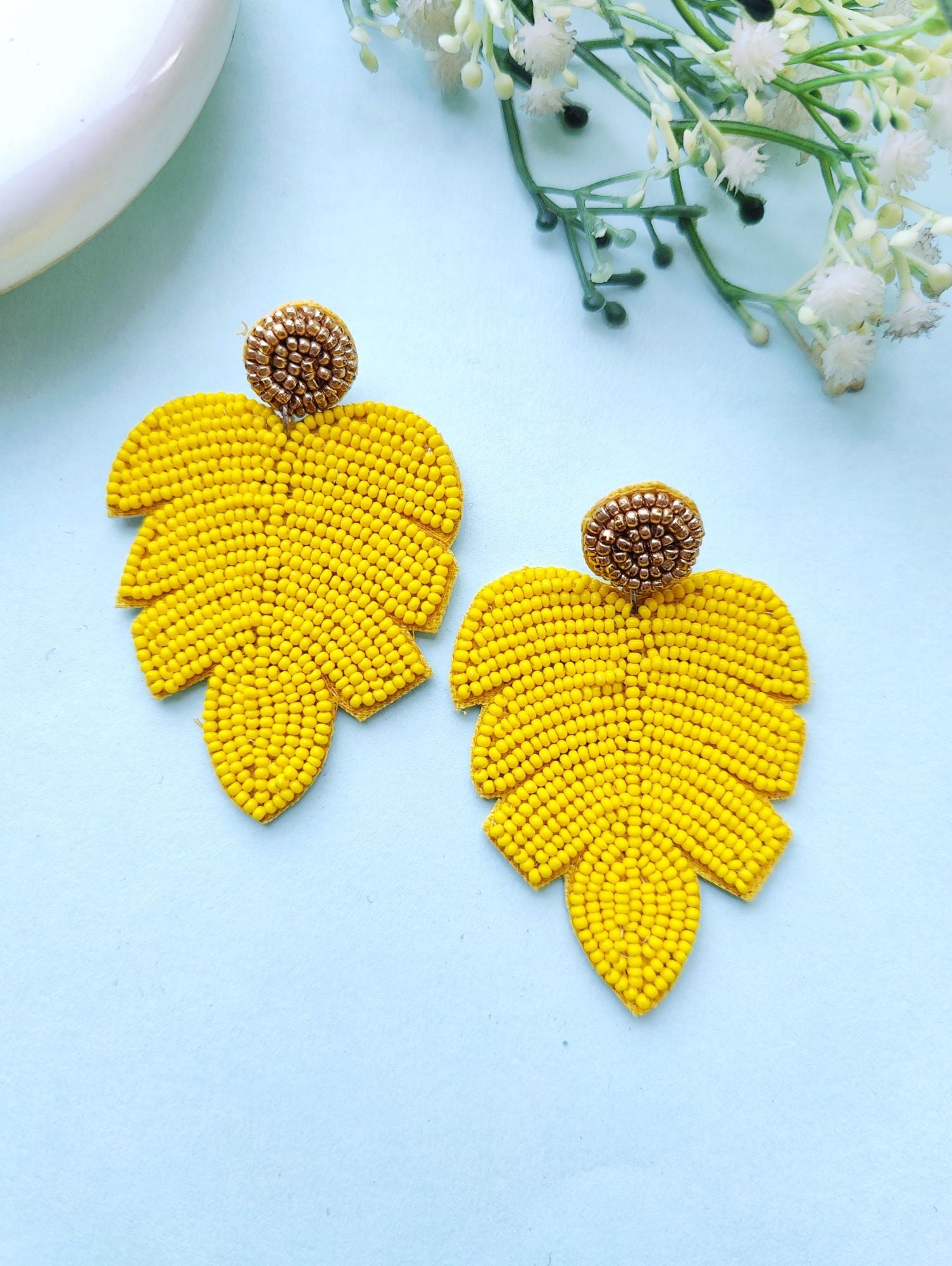 Handicraft collection beaded handmade earrings in leaf shape, vibrant yellow in color, ideal for women and girls to wear in daily life, festivals, or birthdays.