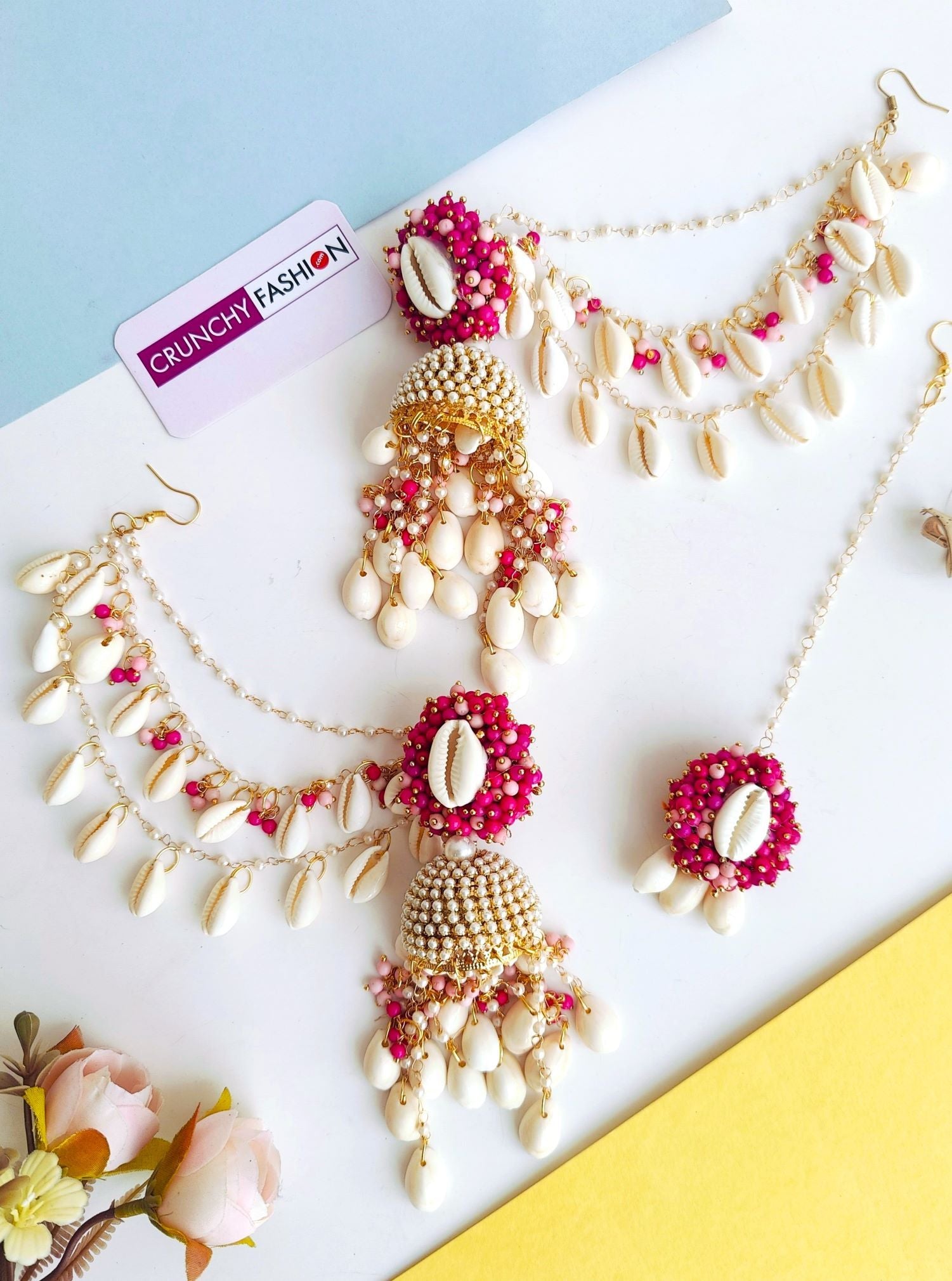 Women's floral-themed Pink Pearl & Sea Shell Jhumka Earrings & Tikka Set for Haldi occasion, handcrafted imitation jewelry