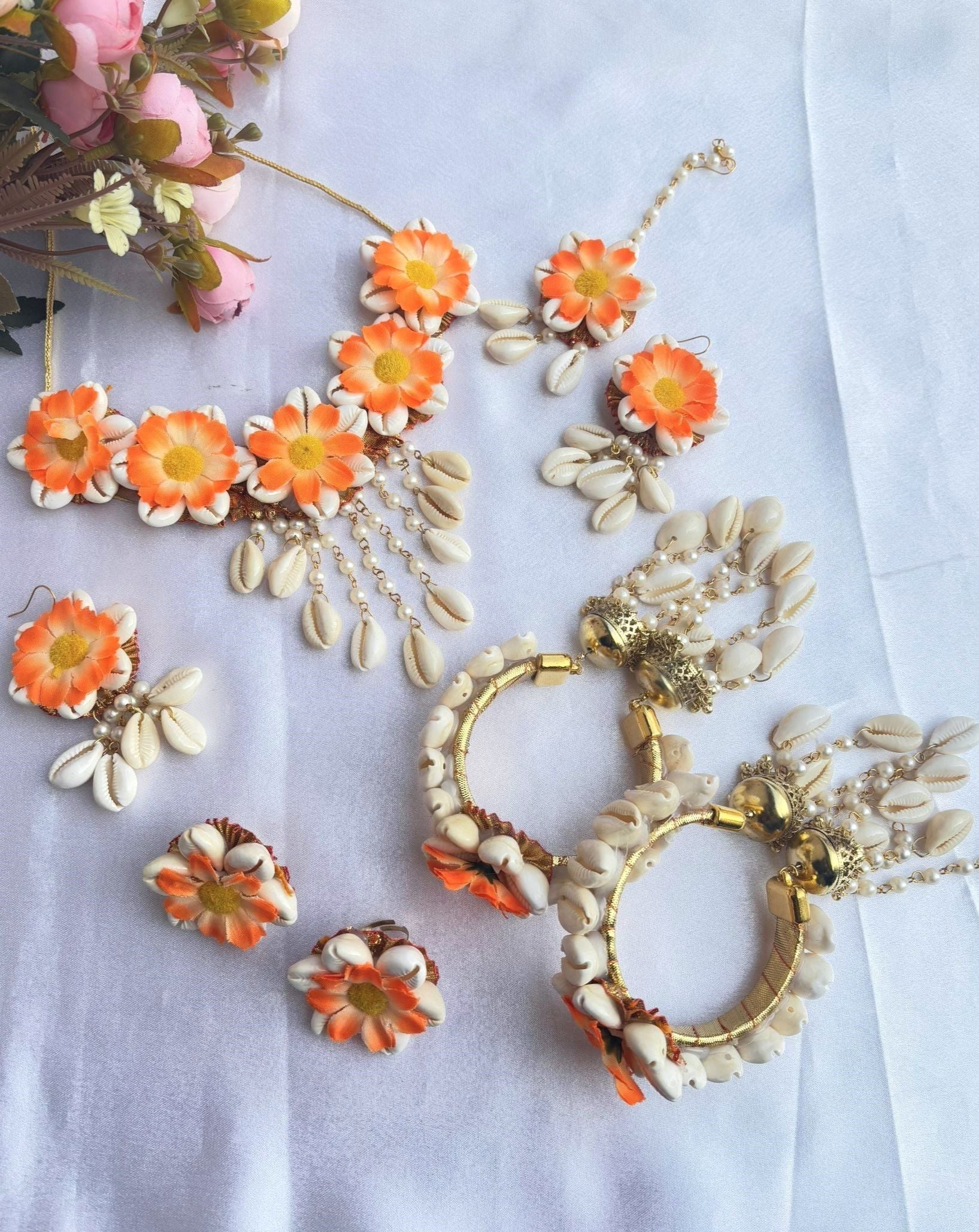 Handmade orange and white artificial flower jewellery set, ideal for baby showers, weddings and haldi ceremonies