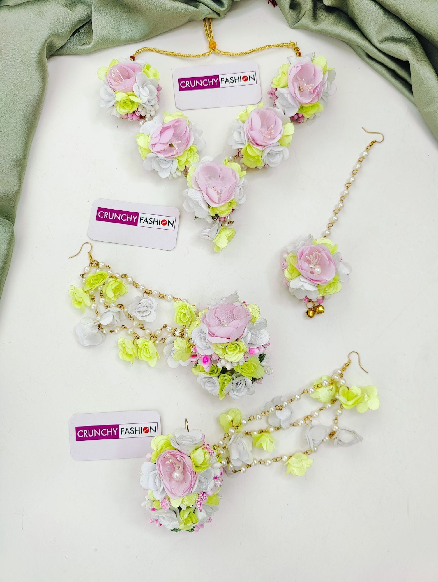 Floral-themed pastel pink and light green artificial flower jewellery set, ideal for women at Mehandi ceremonies