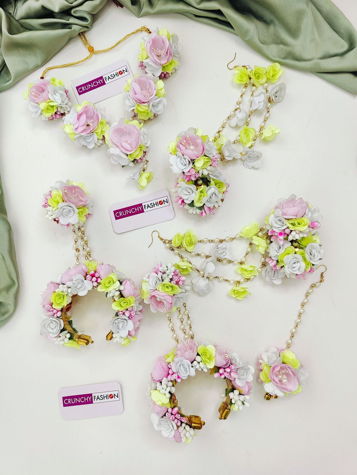 Floral-themed pastel pink and light green artificial flower jewellery set, ideal for women at Mehandi ceremonies