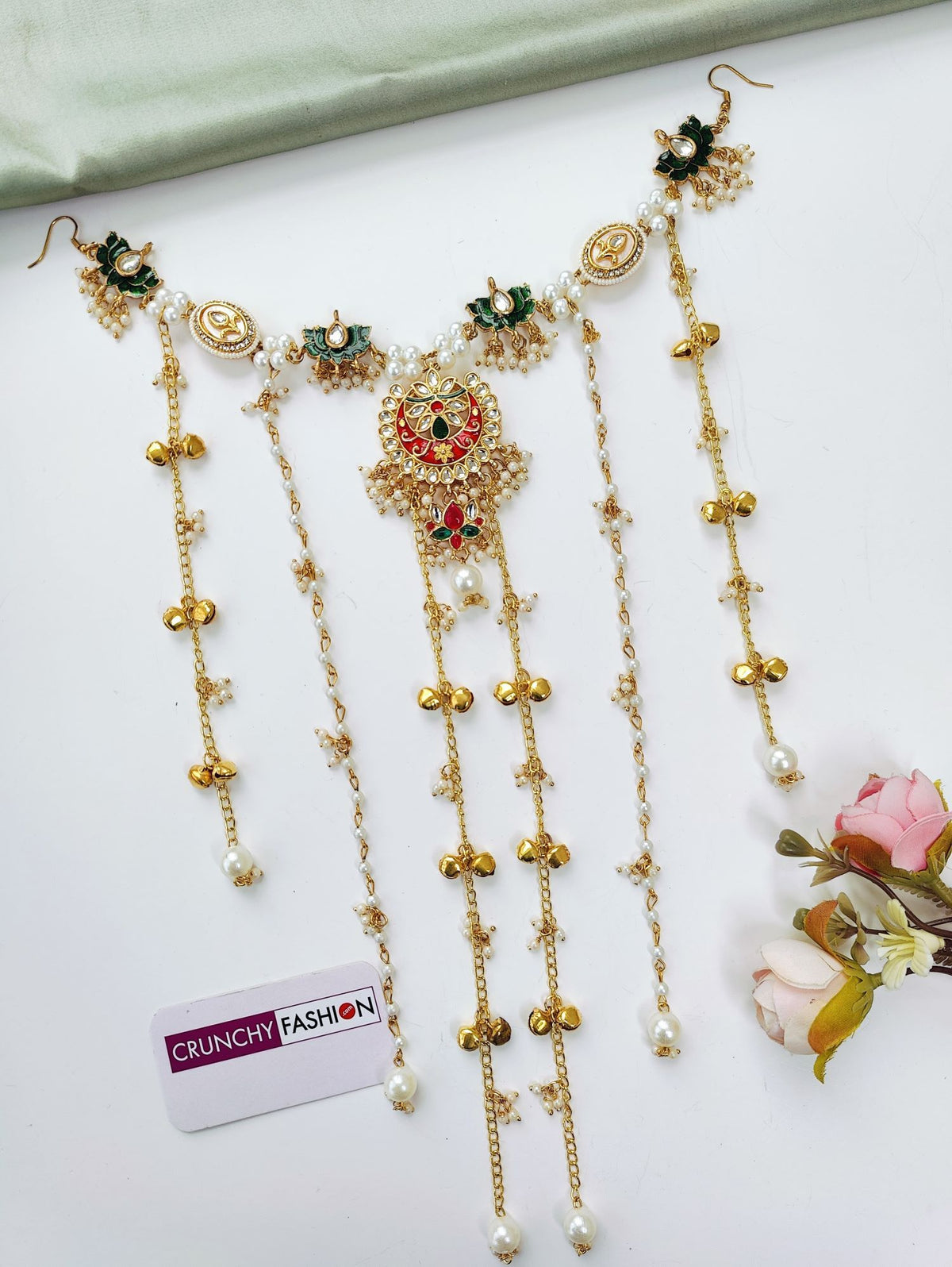 floral kundan hair accessory in green and red for bridal haldi mehndi