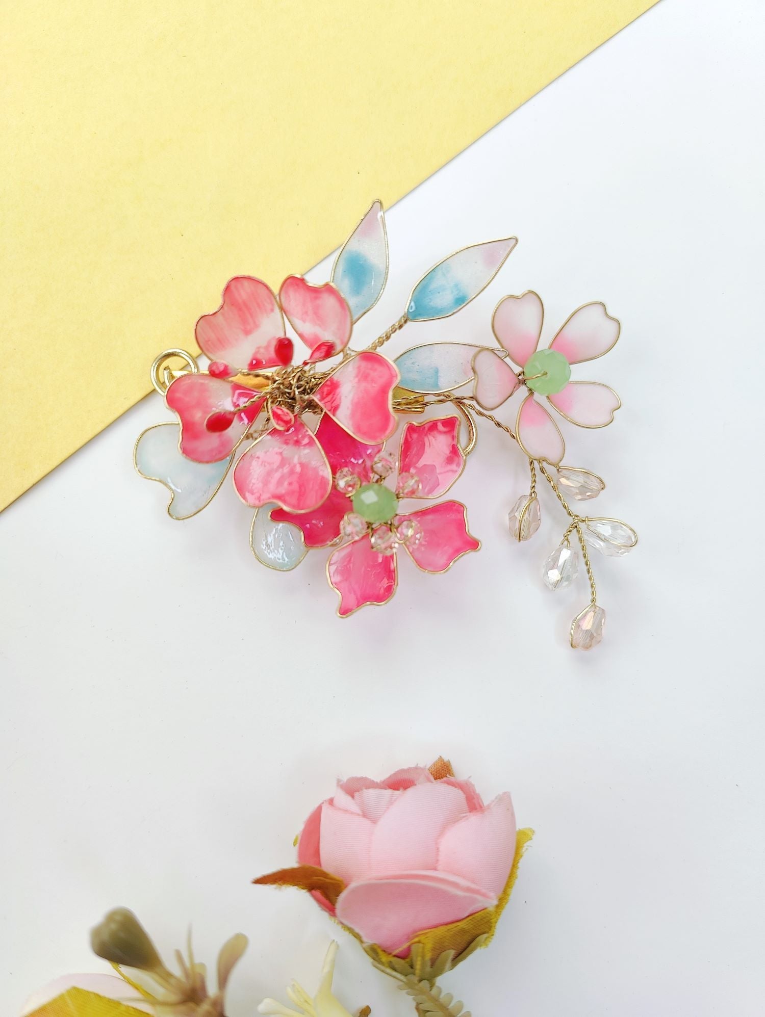 Handmade resin jewellery hair accessory in sky blue and pink, floral design for wedding, haldi or mehandi bun