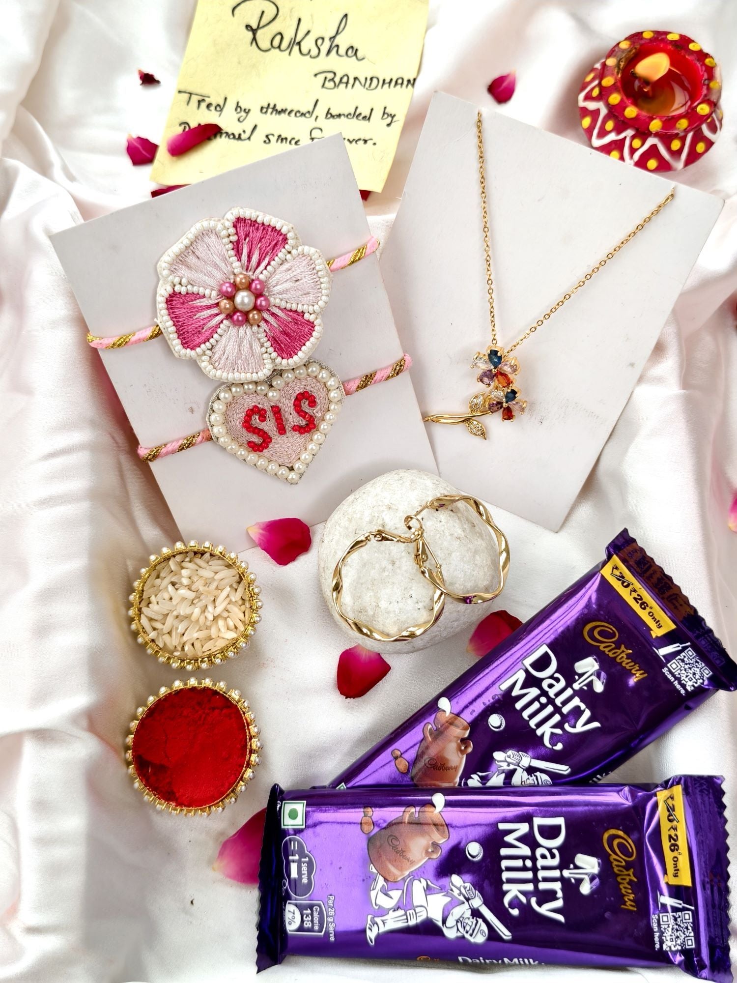 Rakhi hamper set of 2 – cute sis pink flower rakhi with chocolate