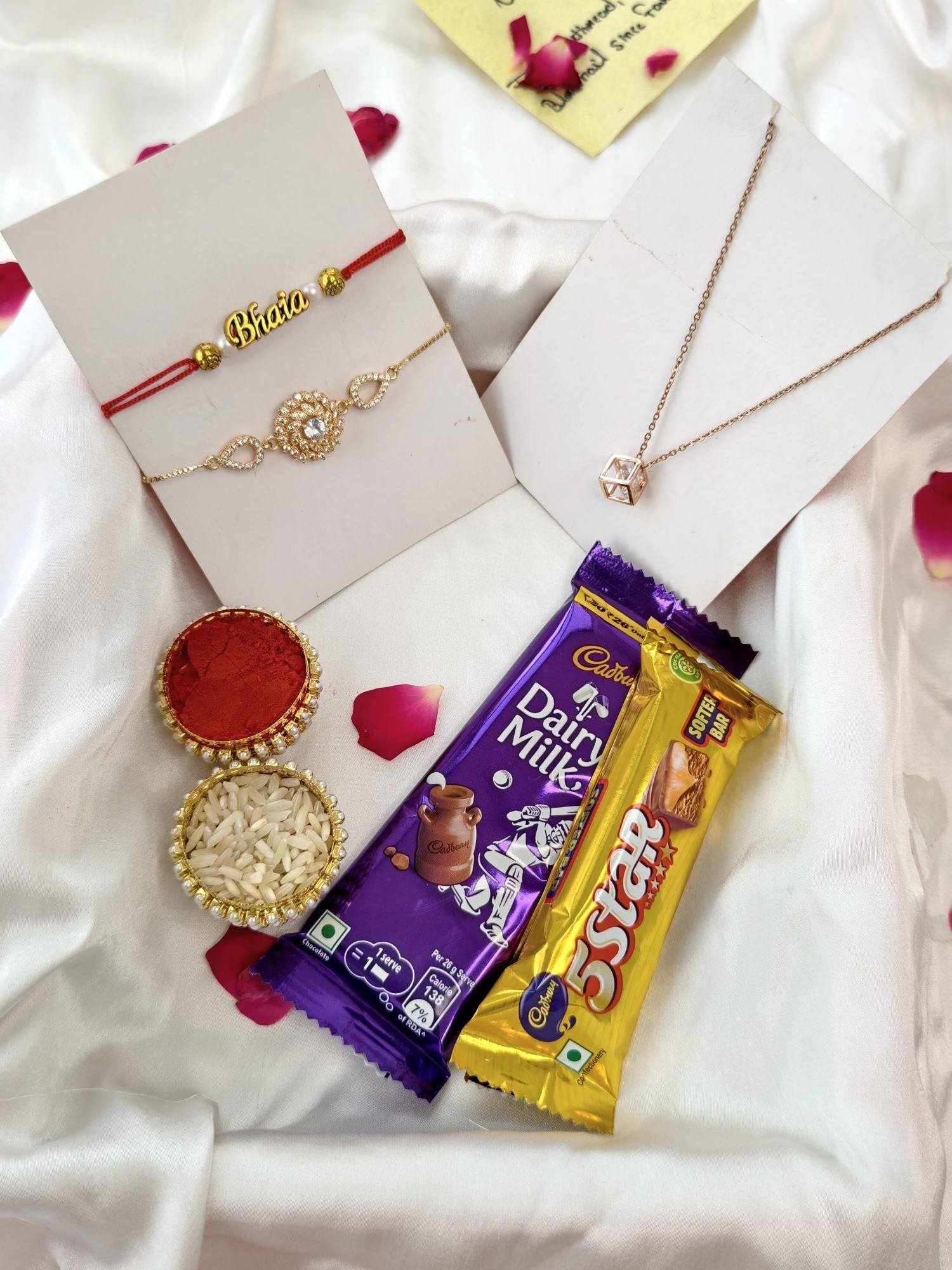 Rakhi hamper for brother with handmade rakhi and Dairy Milk chocolates