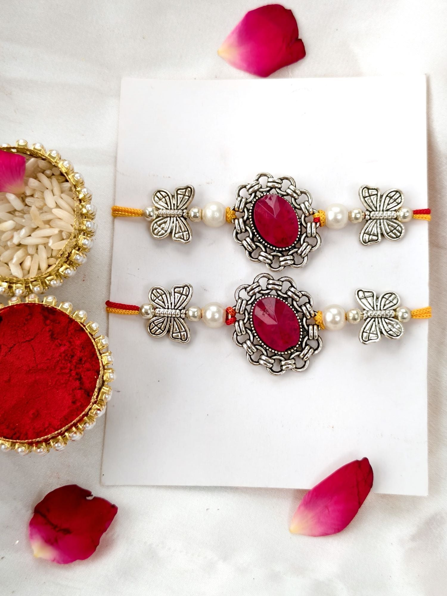Red stone silver rakhi hamper set of 2 with chocolate for brother