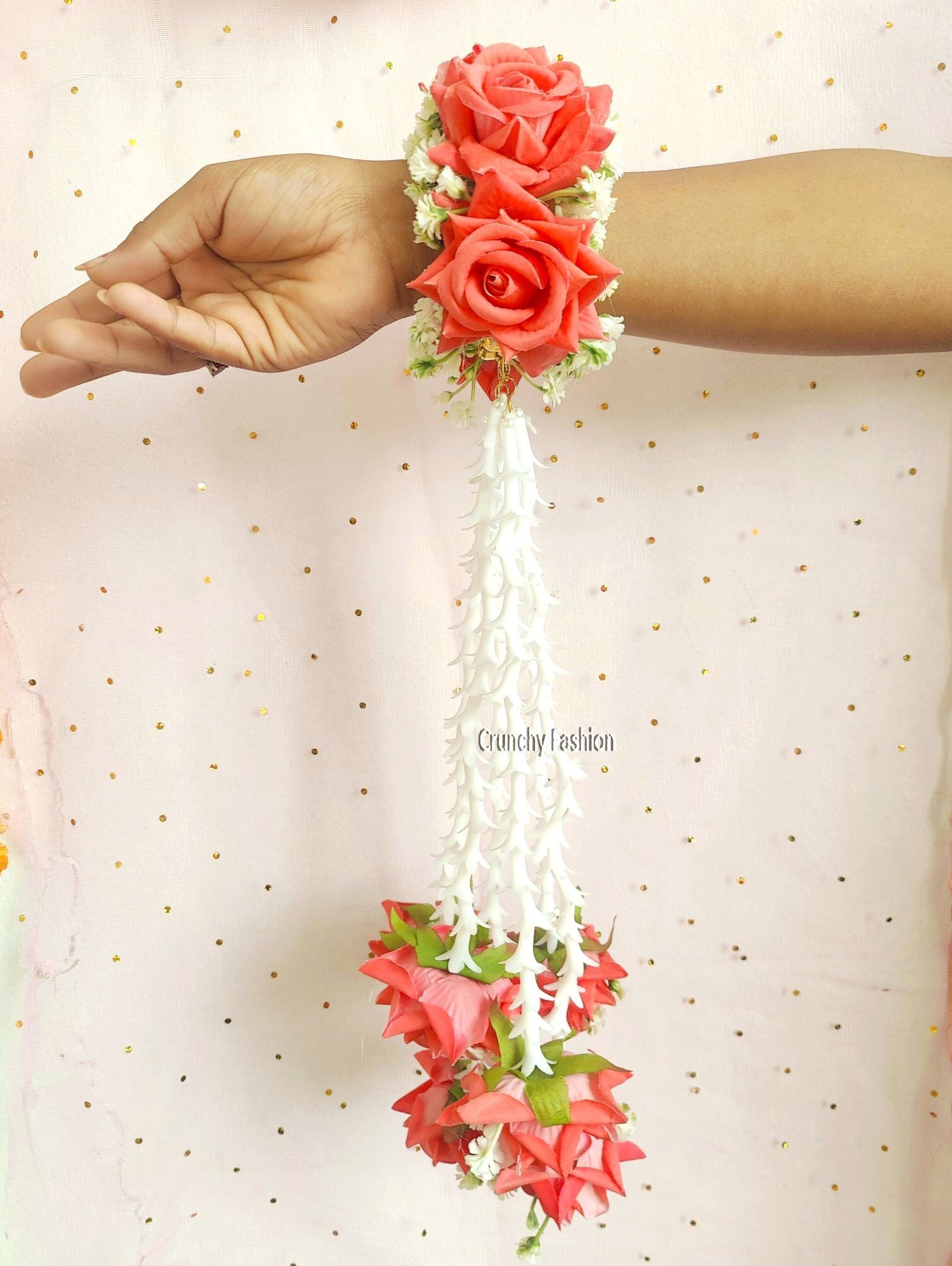 Designer bridal Kalire in pink, yellow, white, perfect for weddings & haldi, made from artificial flowers & pearls.