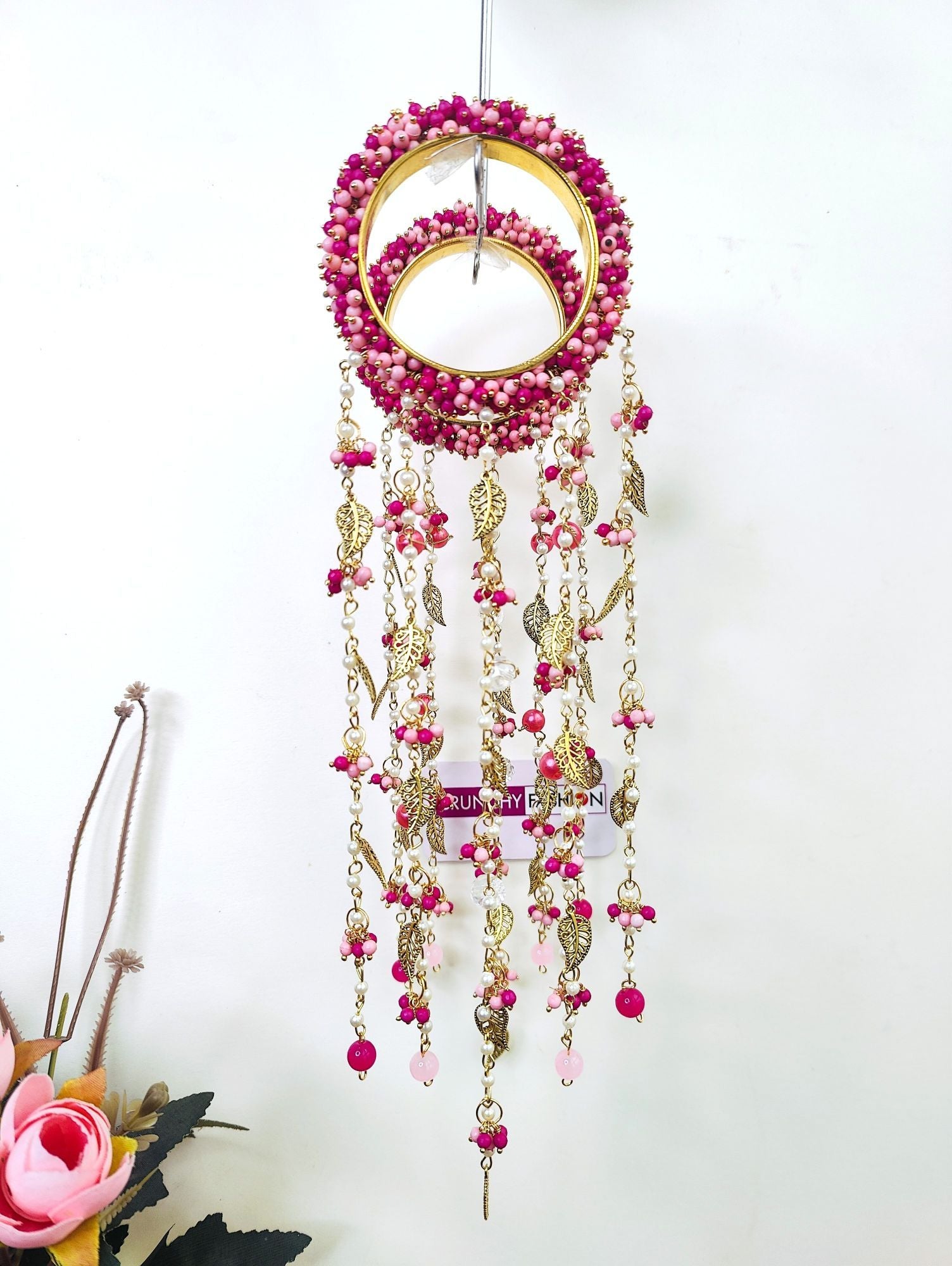 Handmade bridal Kaleere in hot pink and light pink pearls with sea shell accents, ideal for haldi, mehendi, and carnivals