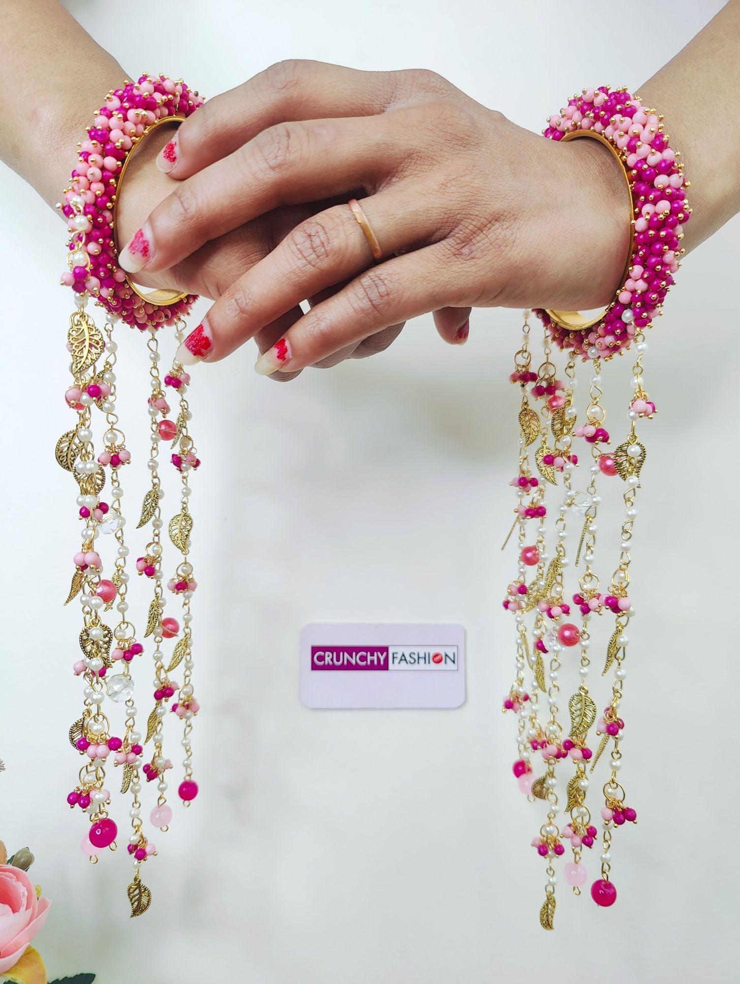 Handmade bridal Kaleere in hot pink and light pink pearls with sea shell accents, ideal for haldi, mehendi, and carnivals