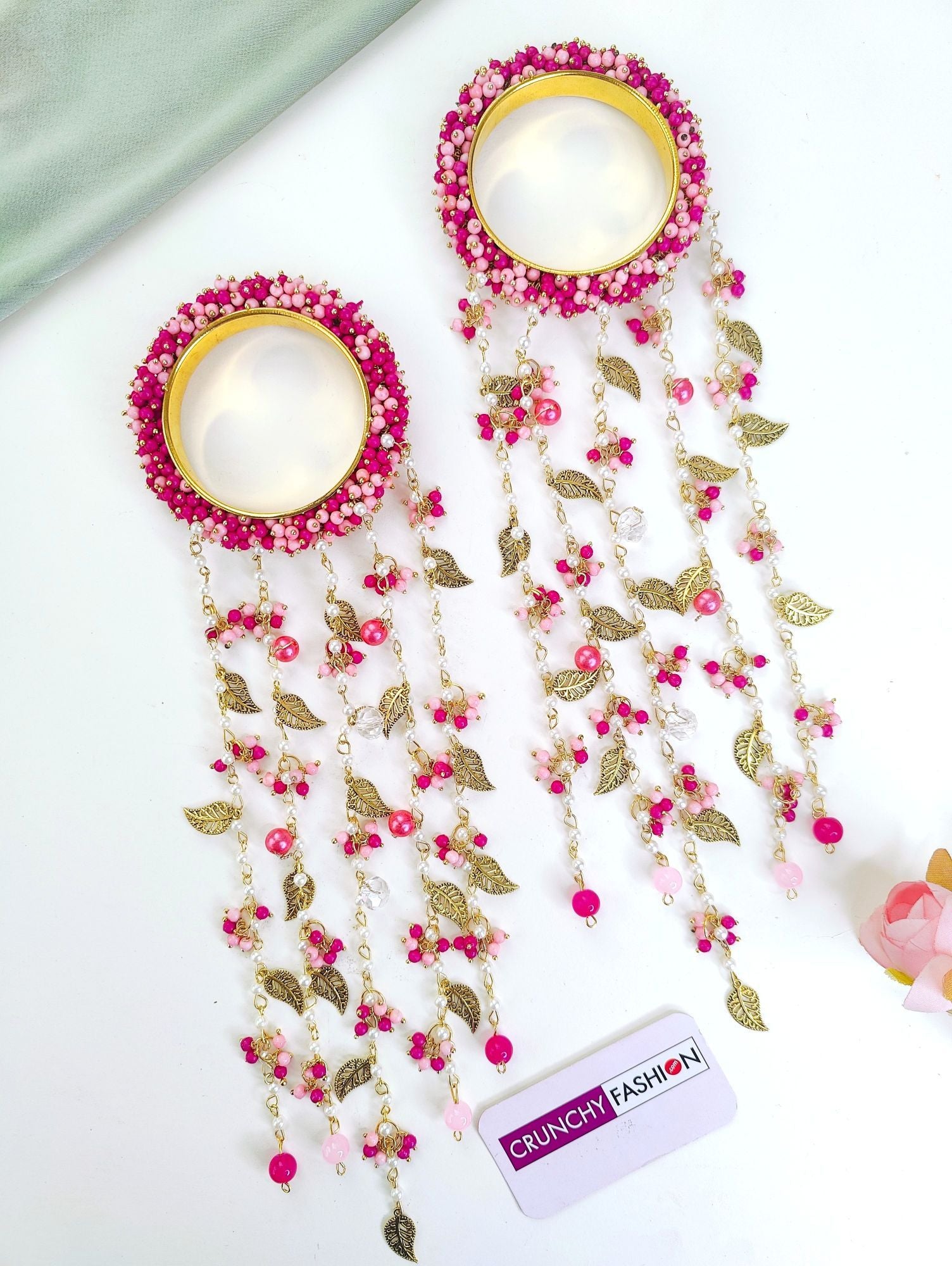 Handmade bridal Kaleere in hot pink and light pink pearls with sea shell accents, ideal for haldi, mehendi, and carnivals