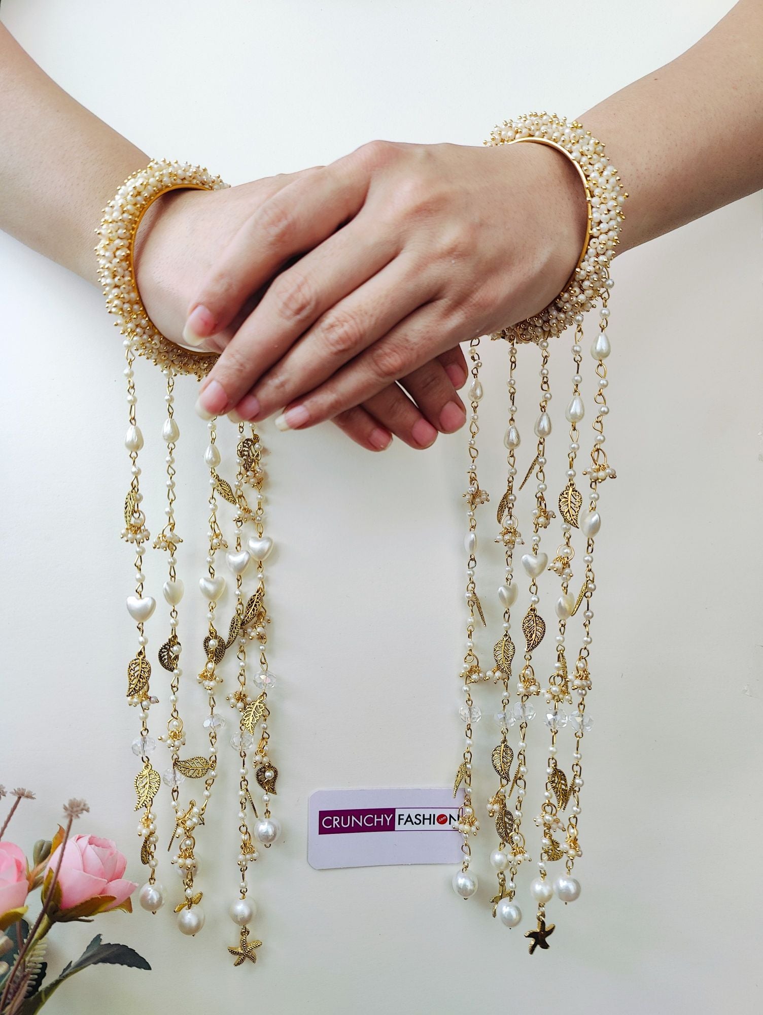Handmade bridal kaleere with white pearls, sea shells, floral design; perfect for haldi, mehndi, weddings, 2026