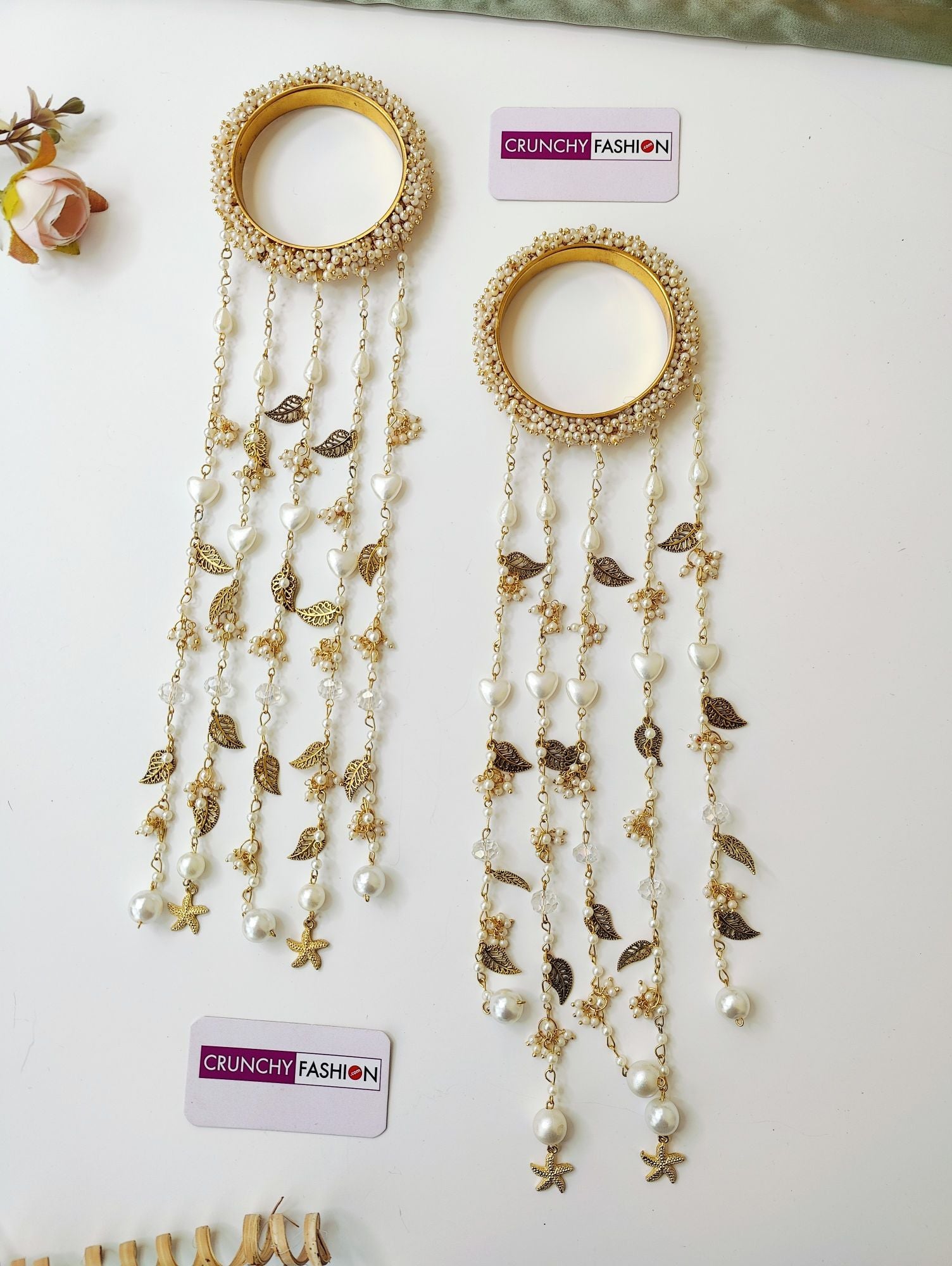 Handmade bridal kaleere with white pearls, sea shells, floral design; perfect for haldi, mehndi, weddings, 2026