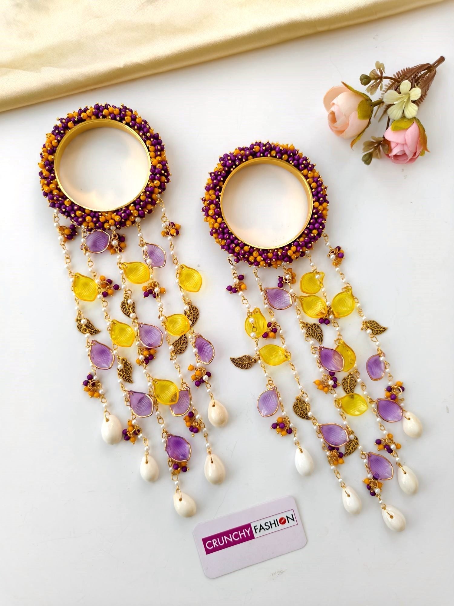 Handmade bridal kaleere in purple, yellow, and white with pearl and shell details, floral design for women