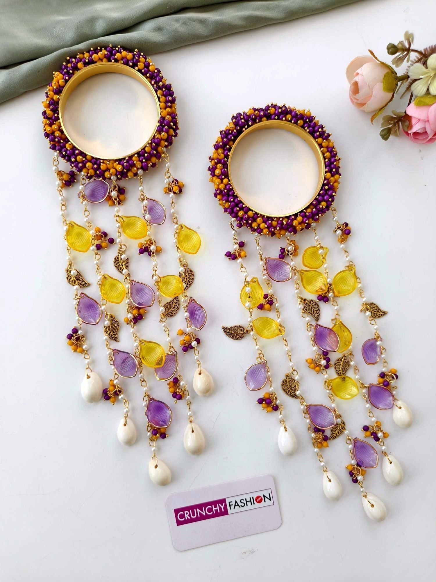 Handmade bridal kaleere in purple, yellow, and white with pearl and shell details, floral design for women