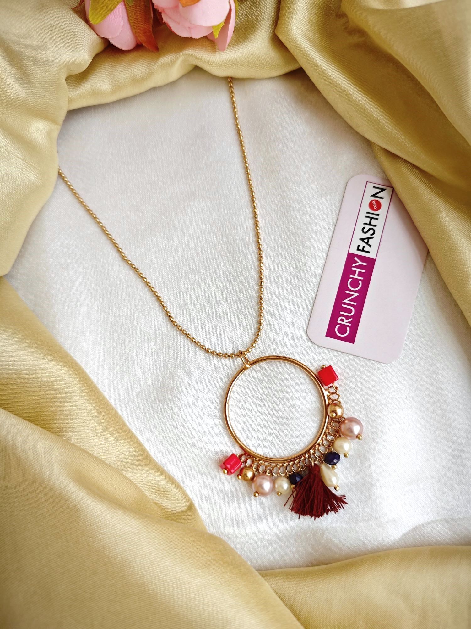 Designer eye-shaped crystal pendant necklace in gold, white, and blue color for women and girls