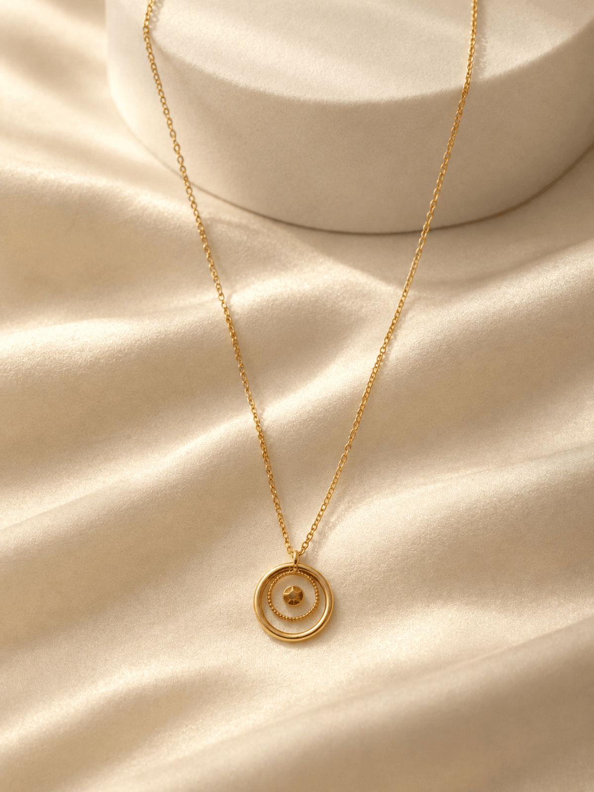 Designer crystal gold pendant necklace for women, brass cable chain, gemstone detail, ideal for party or date