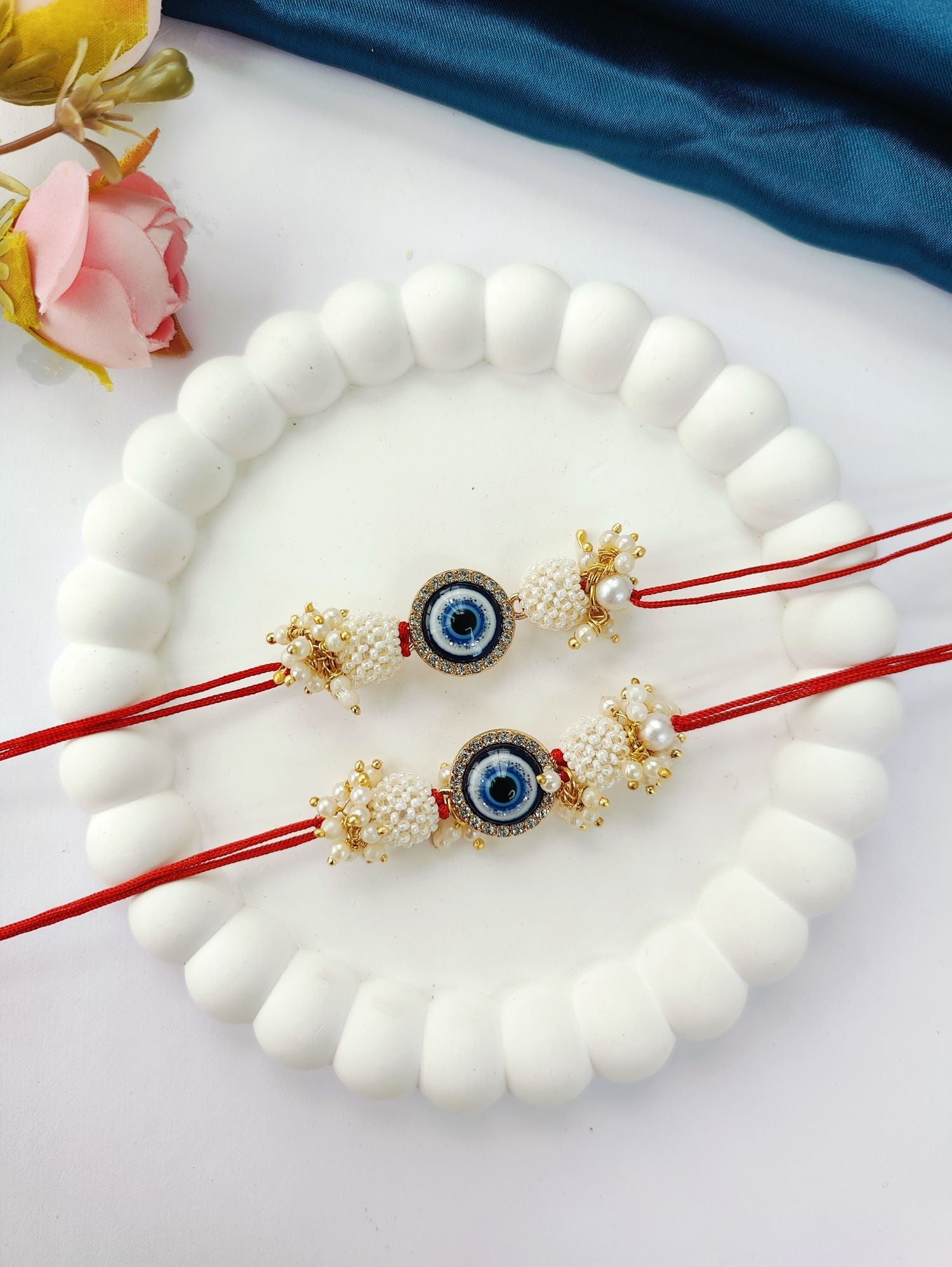 blue handmade evil eye rakhi set for bhaiya bhabhi, pearl beads