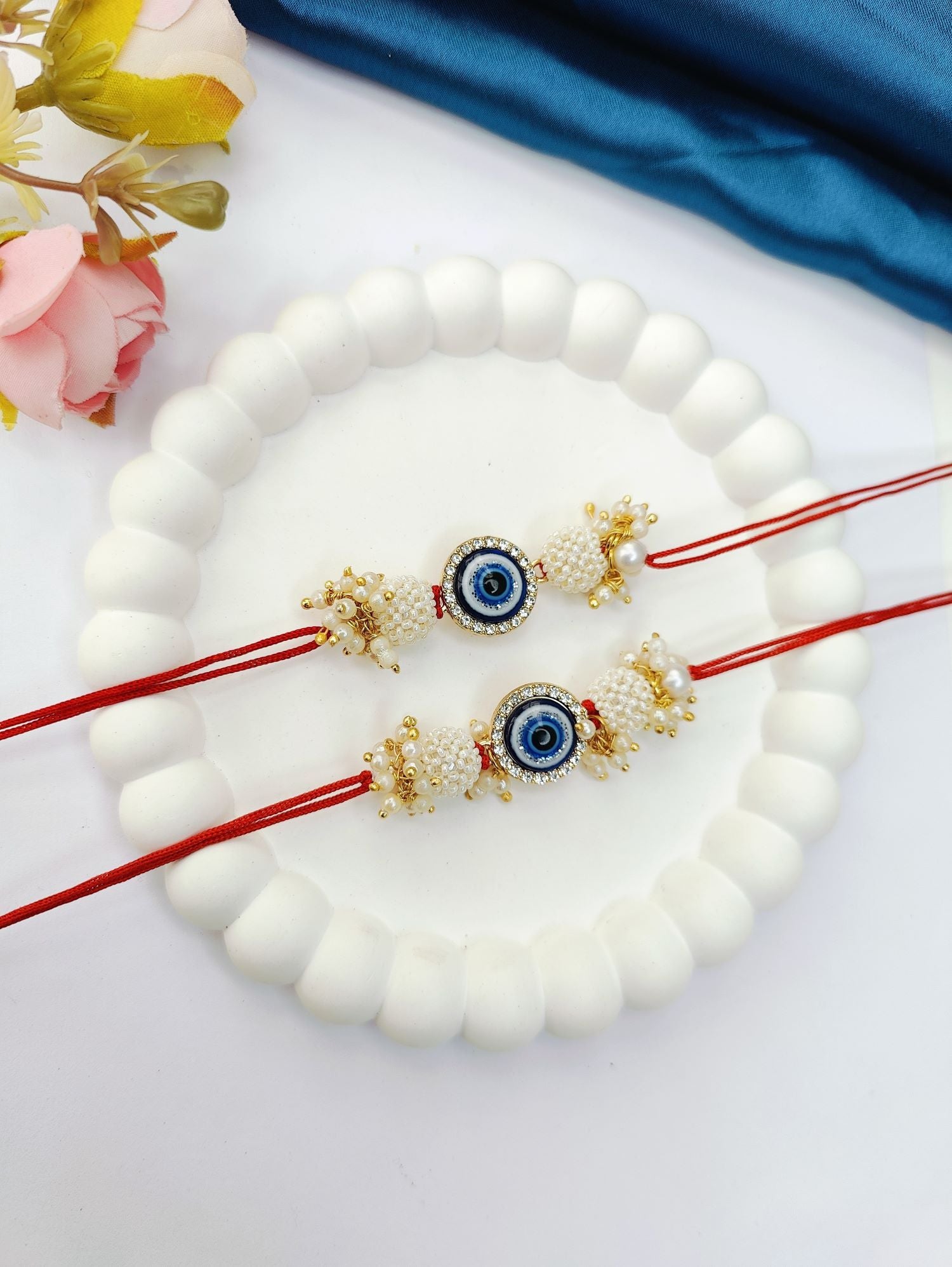 blue handmade evil eye rakhi set for bhaiya bhabhi, pearl beads