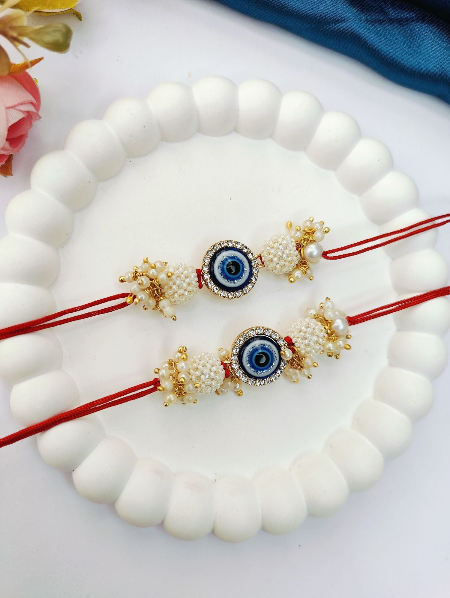 blue handmade evil eye rakhi set for bhaiya bhabhi, pearl beads