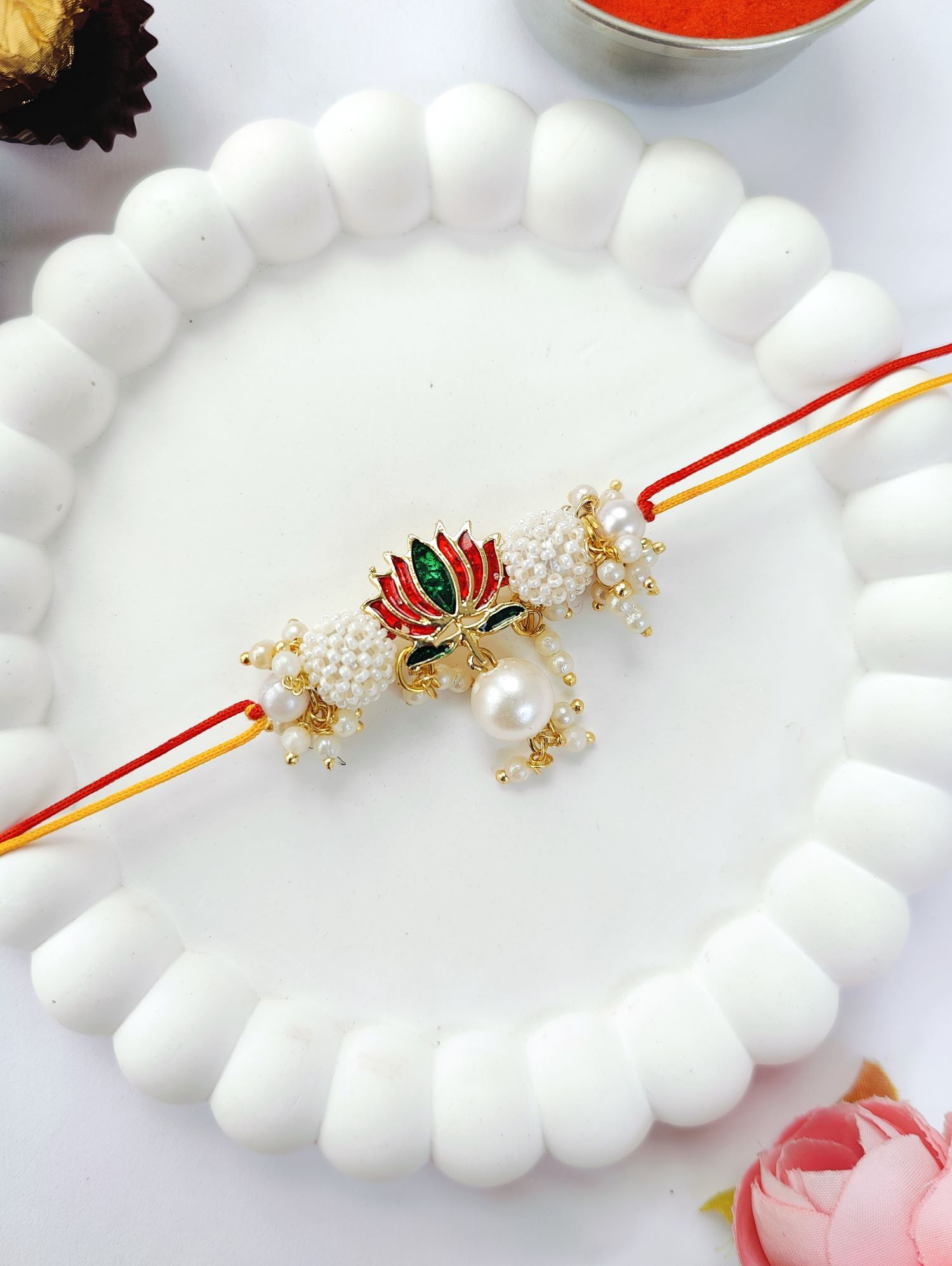 handmade lotus couple rakhi for bhaiya bhabhi with pearl bead design