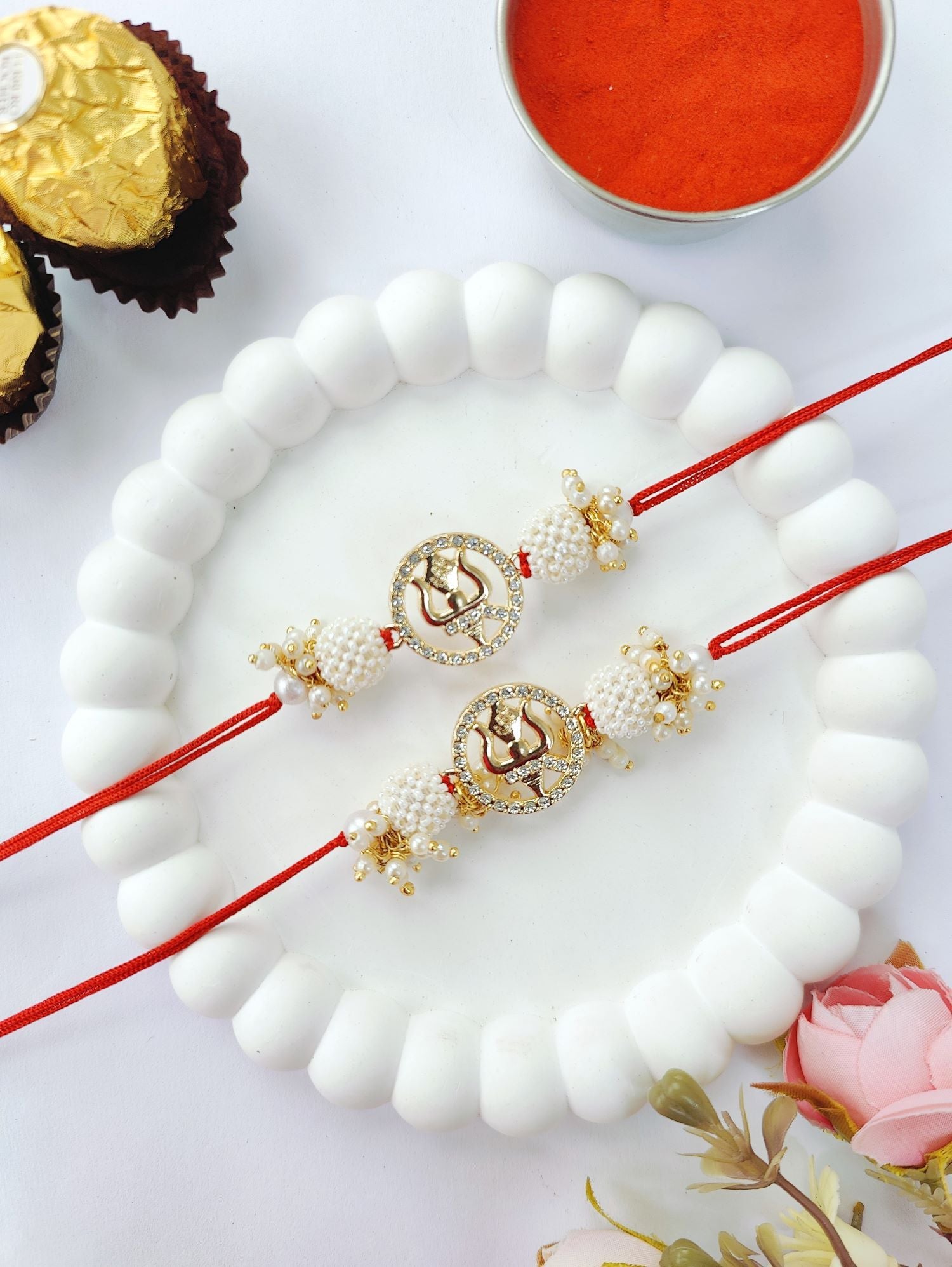 white couple set trishul rakhi design with pearl bead rakhi for bhaiya bhabhi 2026