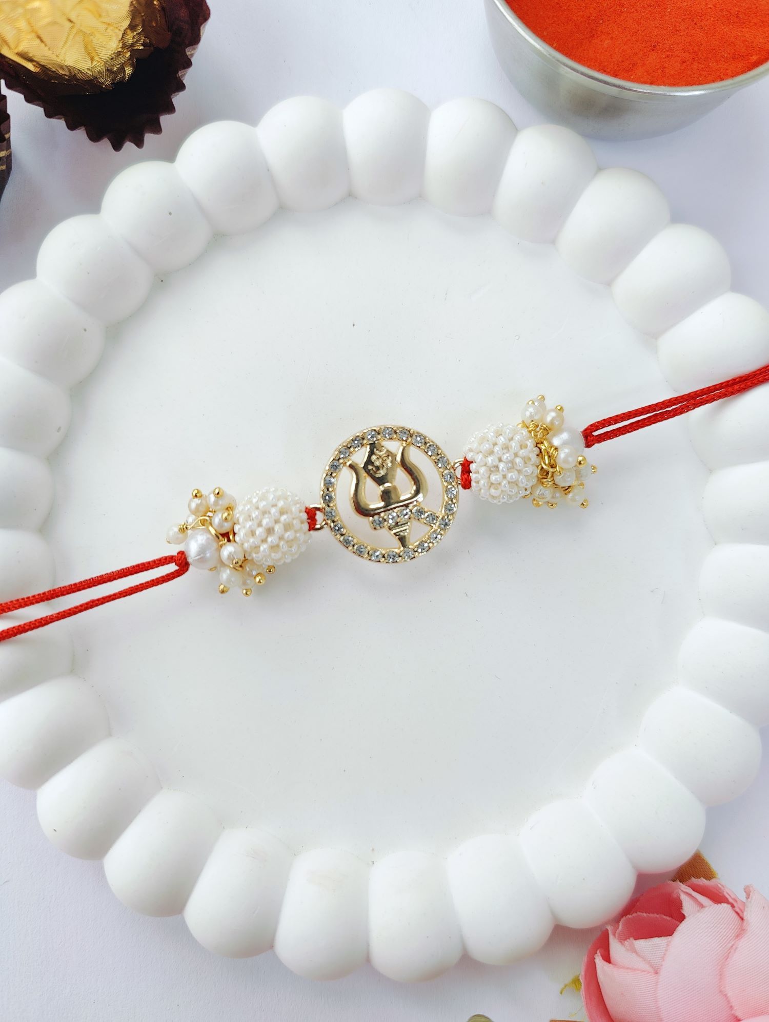 white couple set trishul rakhi design with pearl bead rakhi for bhaiya bhabhi 2026
