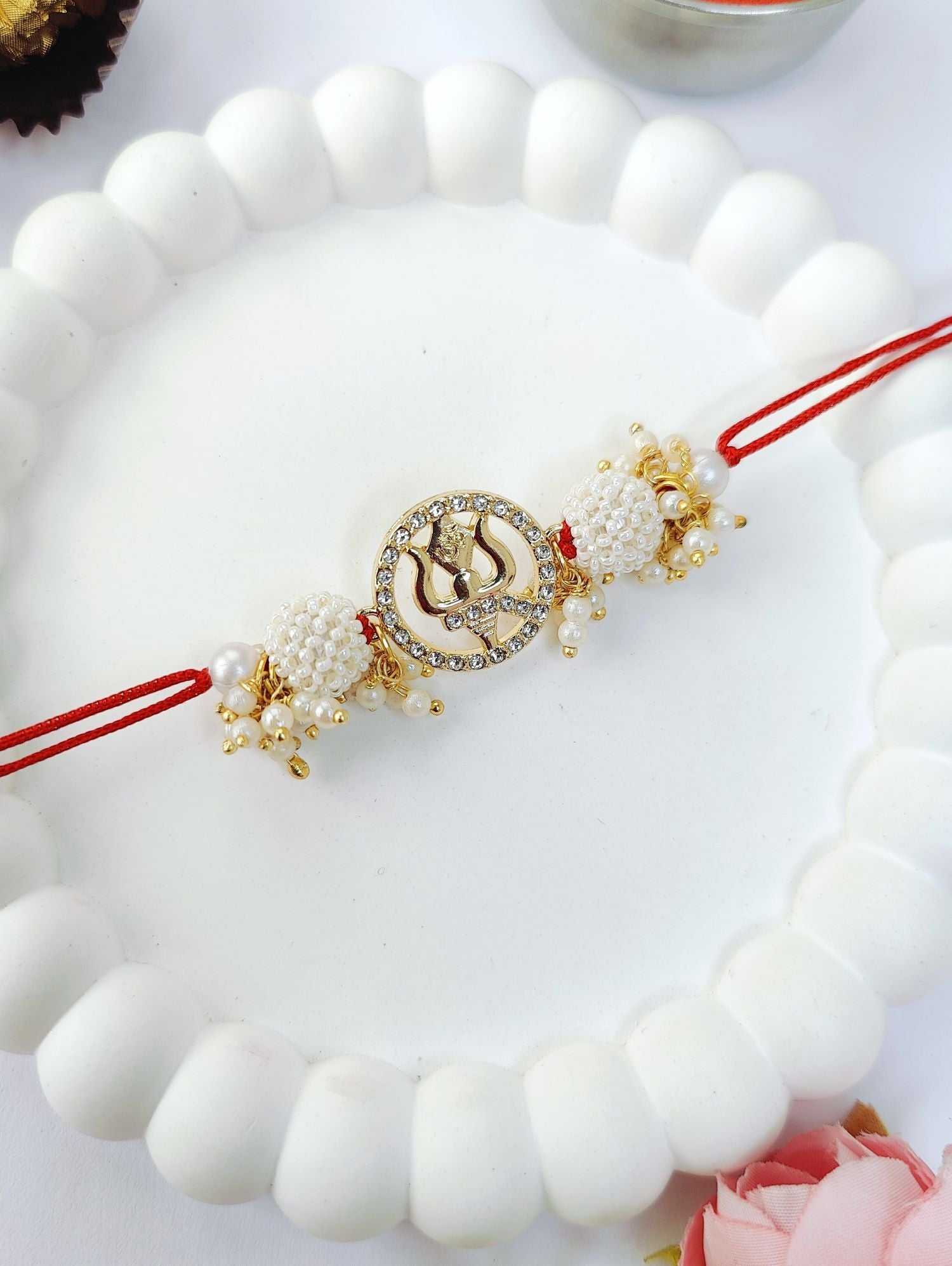 white couple set trishul rakhi design with pearl bead rakhi for bhaiya bhabhi 2026
