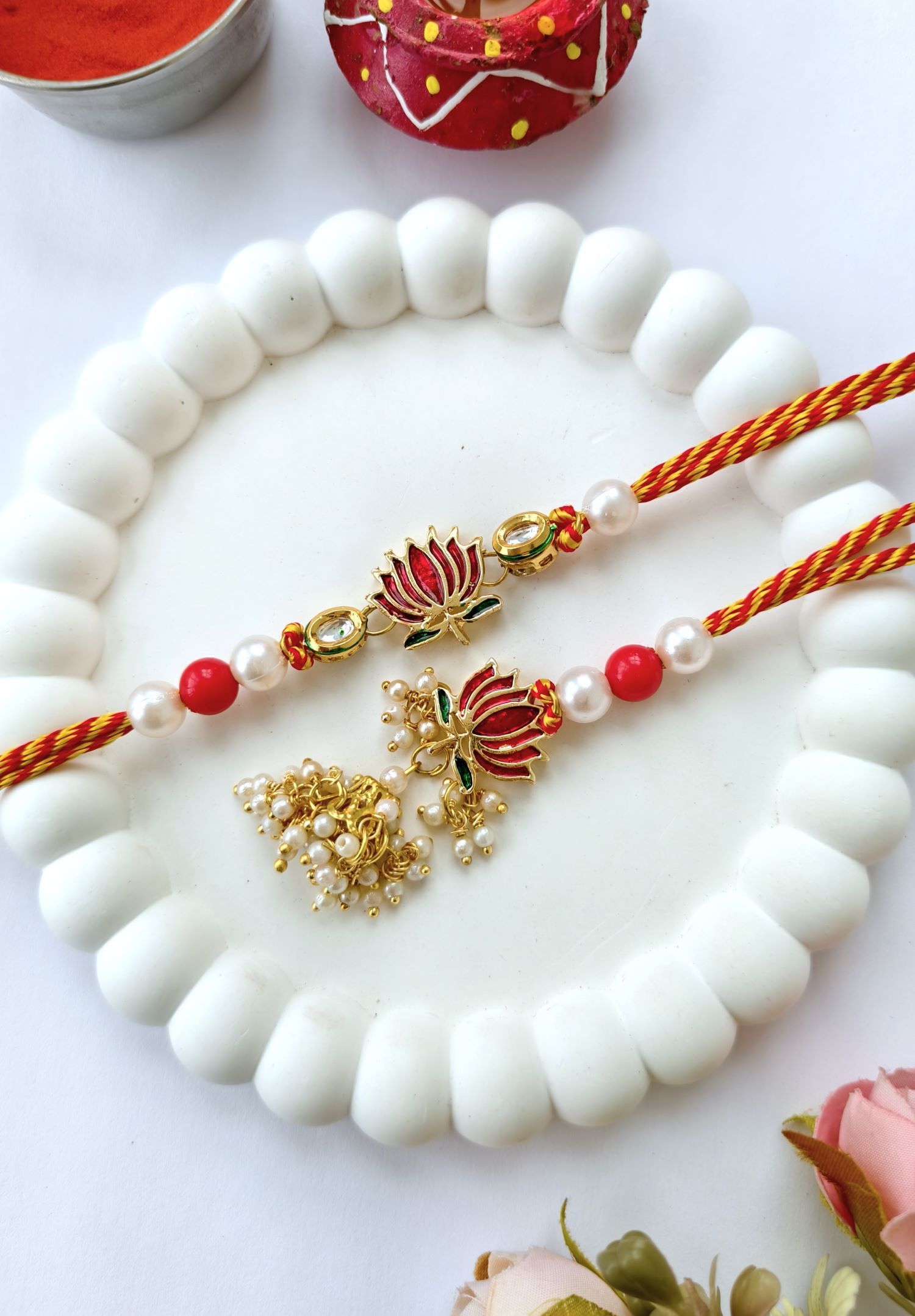 designer lotus rakhi set, red green kundan couple rakhi for bhaiya bhabhi 2026