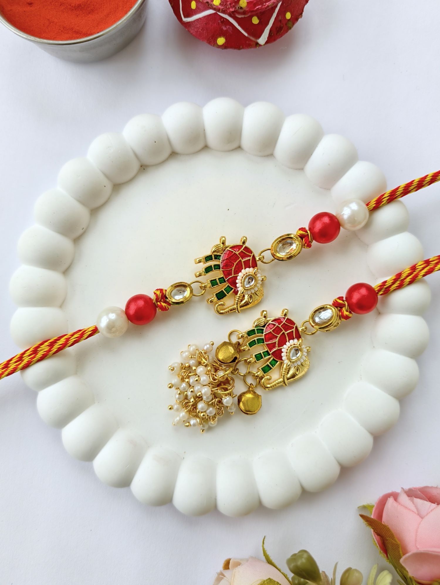 handmade elephant design bracelet rakhi, red green kundan couple set